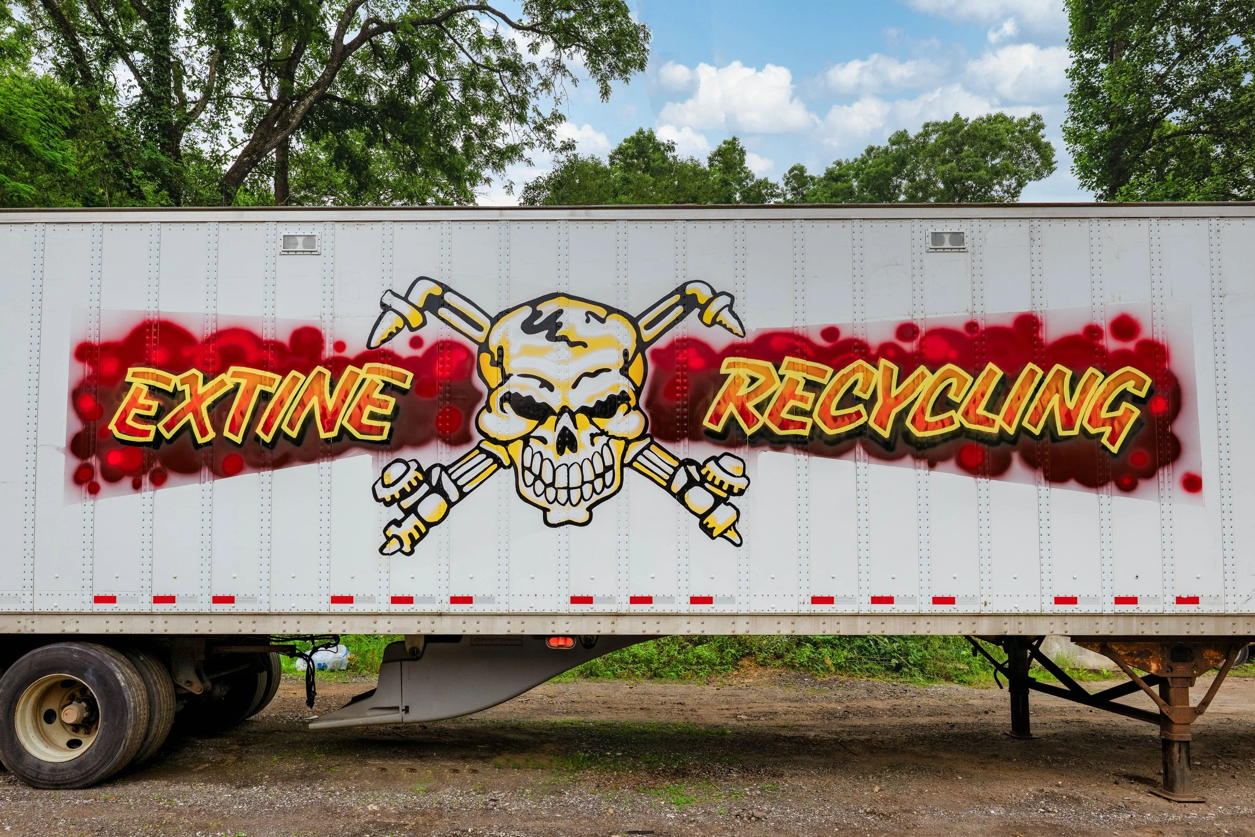 Business image on the side of a semi truck thats becomes a rolling billboard