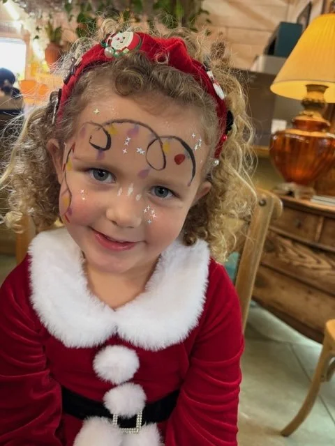 Miss Mary made many little friends at Carolina Gardens Christmas