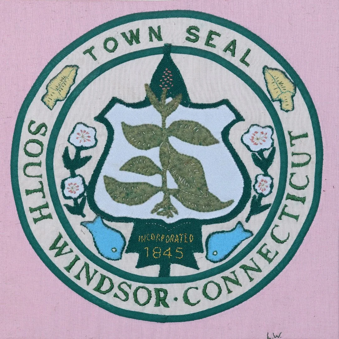 Windsor, Connecticut town seal featuring a plant, flowers, and fish, with the text 'Incorporated 1845' on a light pink background.