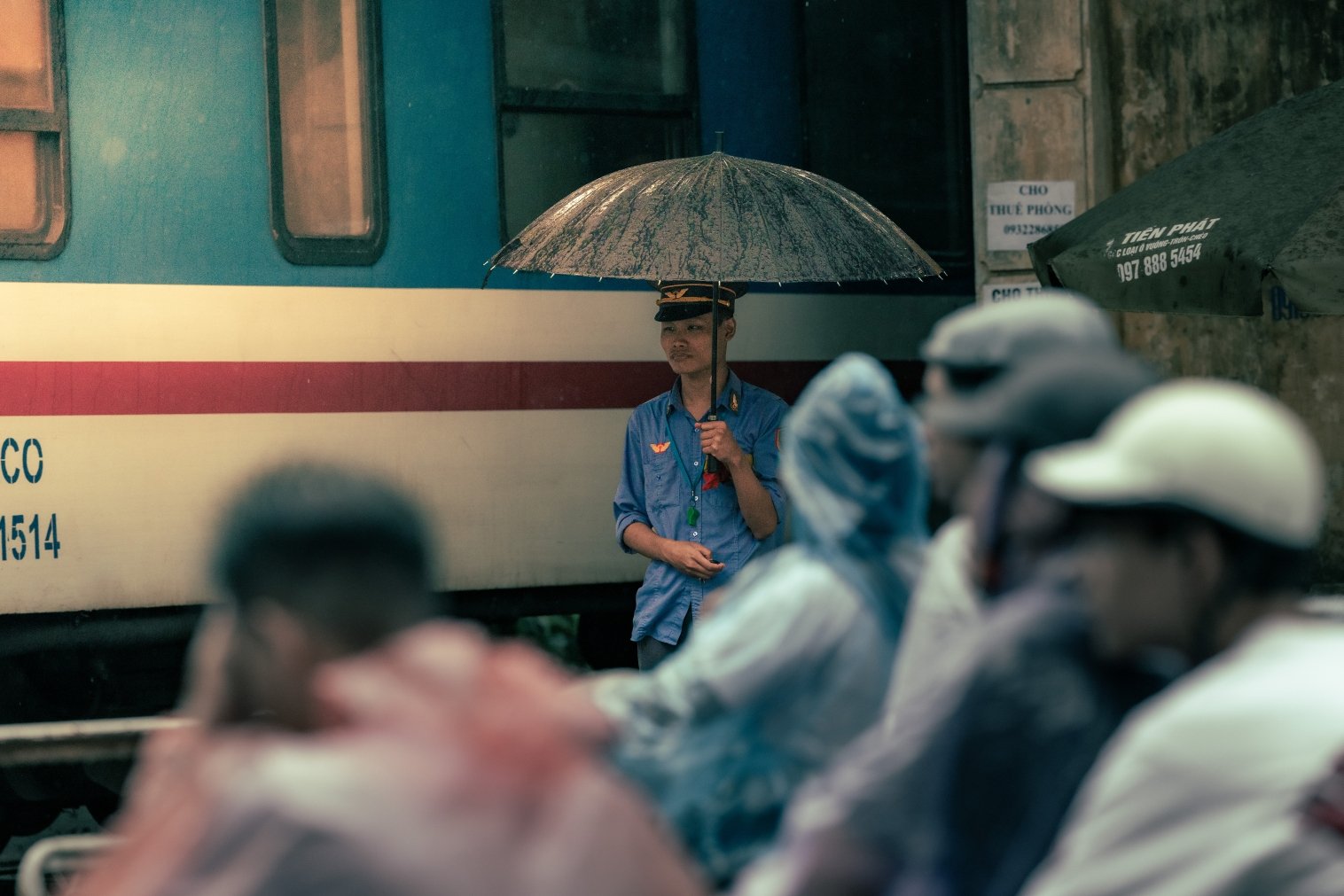 train attendant in the rain copy.jpg