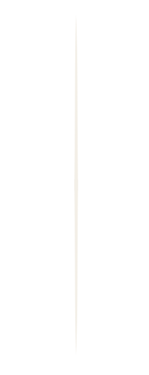 A vertical pole with black and white stripes, featuring a small sign near the top.