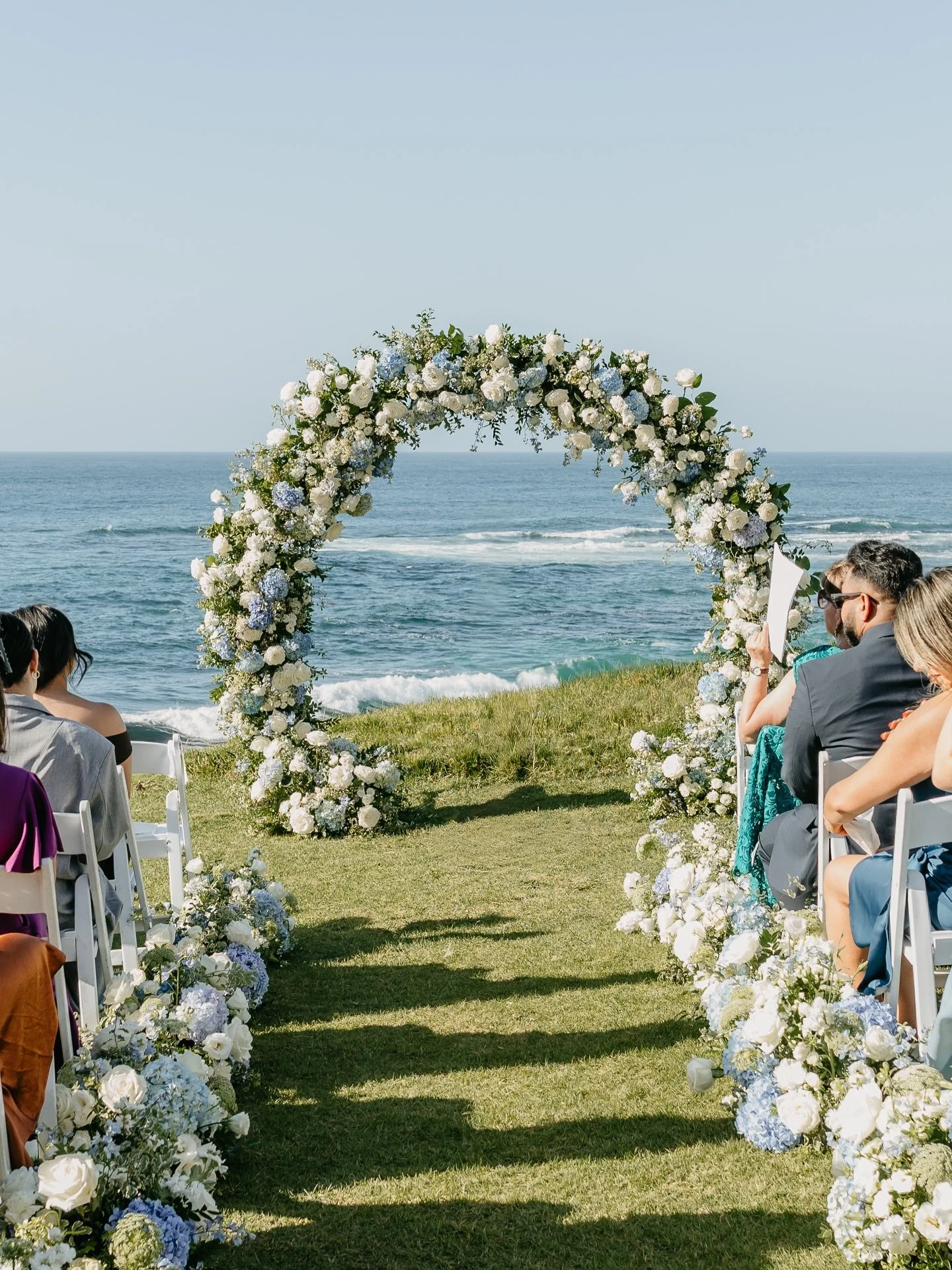 Such an honor designing for Emily &amp; Diego&rsquo;s coastal ceremony at Cuvier Park in La Jolla 🤍Their vision of blue and white florals with the full arch and aisle markers created a timeless and cohesive look with the ocean backdrop. After the ce