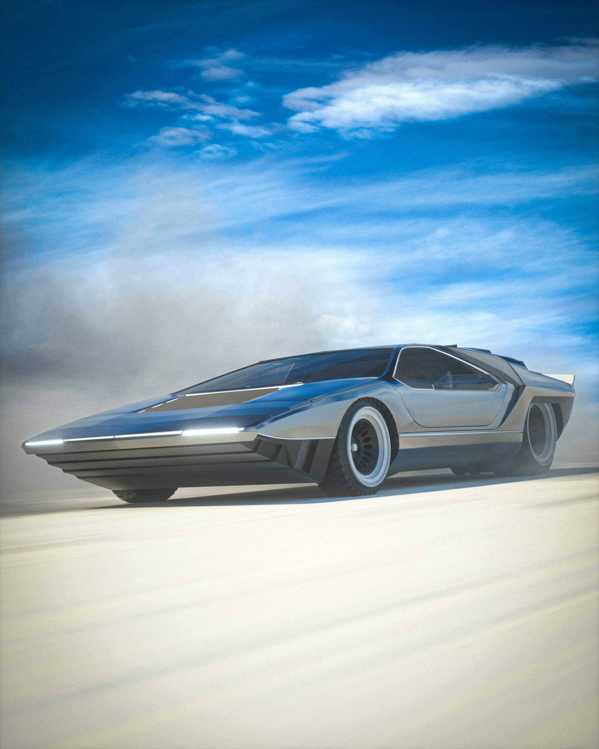 A futuristic silver and black sports car driving on a desert landscape with a blue sky and wispy clouds in the background.