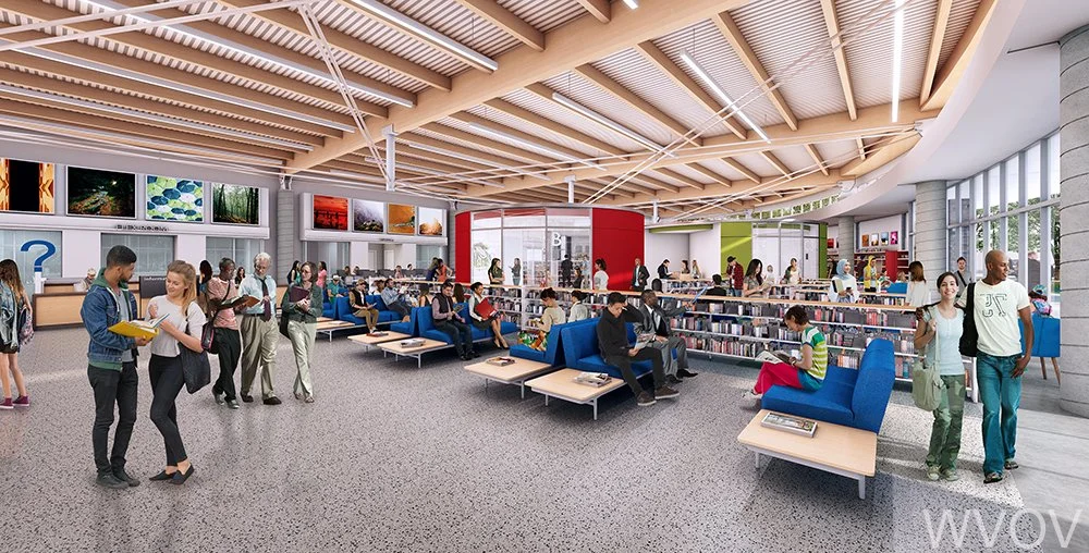 Interior of a modern library with people sitting and walking, bookshelves, and large windows.