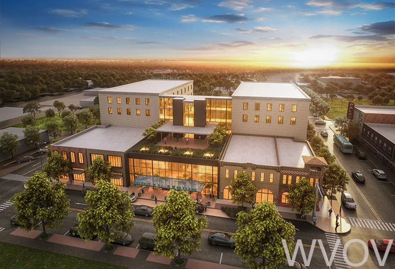 Rendering of a modern multi-story building with a rooftop terrace, large glass windows, and ground-floor retail stores, surrounded by trees and parked cars at sunset.