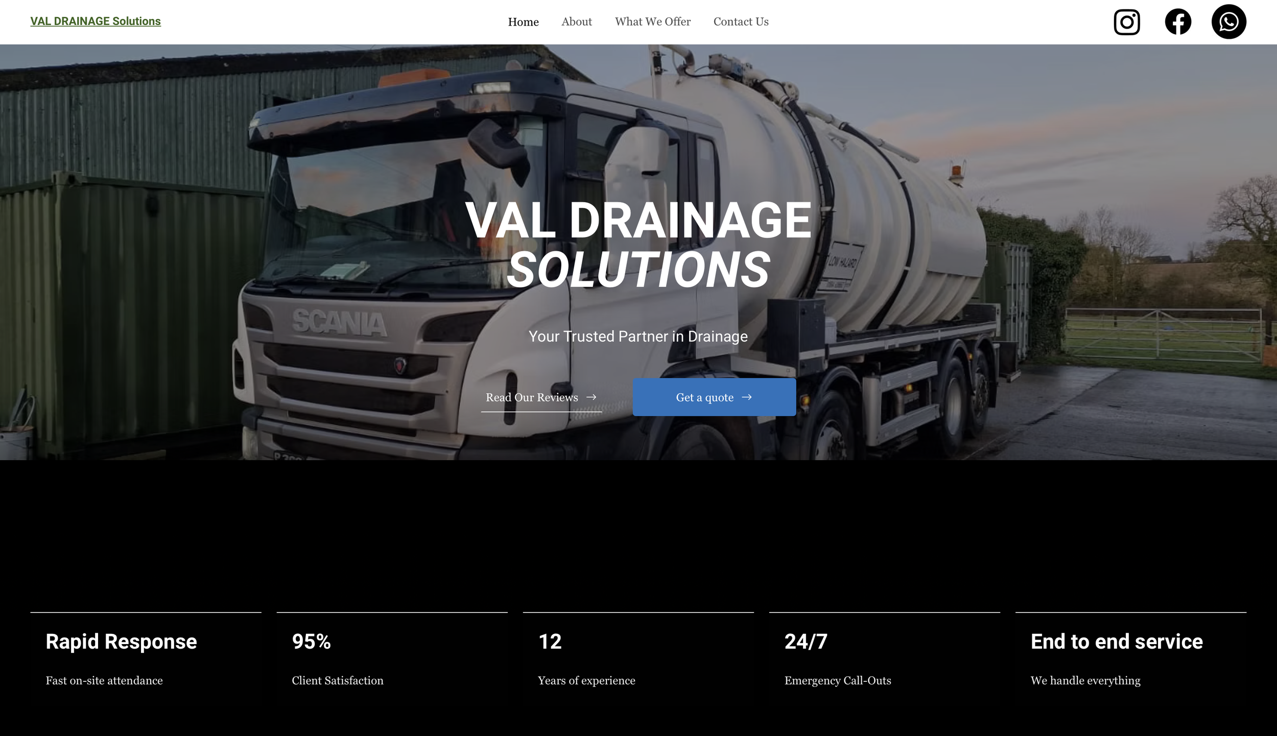 A website homepage for VAL Drainage Solutions featuring an image of a white tanker truck parked outdoors with a green fence and trees in the background. The website header includes navigation links and social media icons.