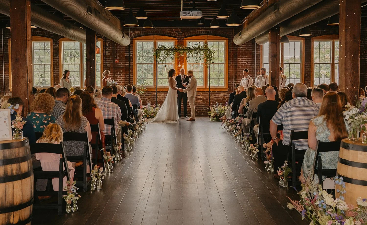 Wedding and Elopement Floral Design provided by For Honey Florals walking down the aisle at wedding