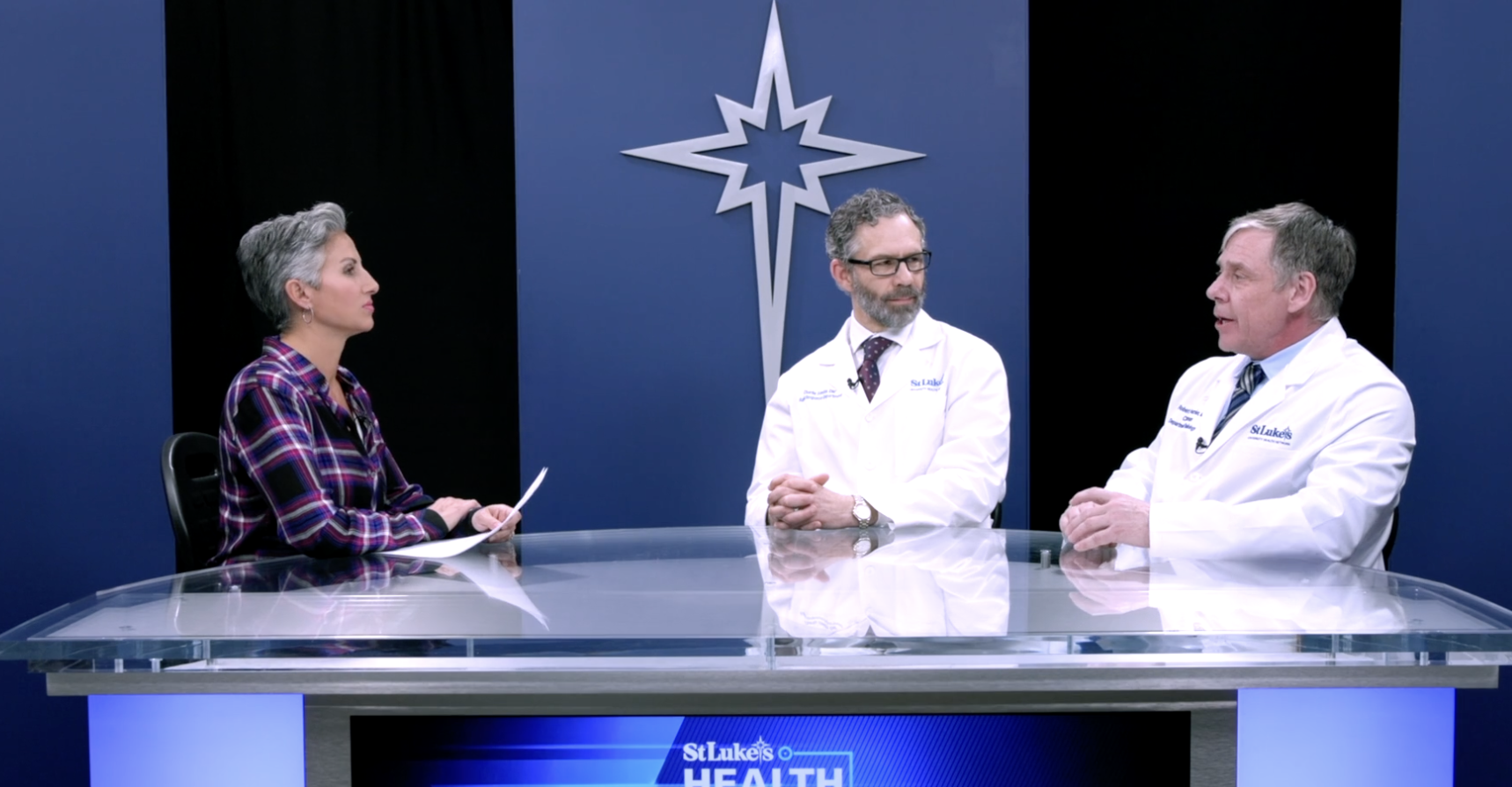Ashley Russo talking with two male physicians from St. Luke's Health Network about AI