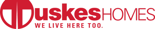 Duskes Homes logo with slogan 'We live here too.'