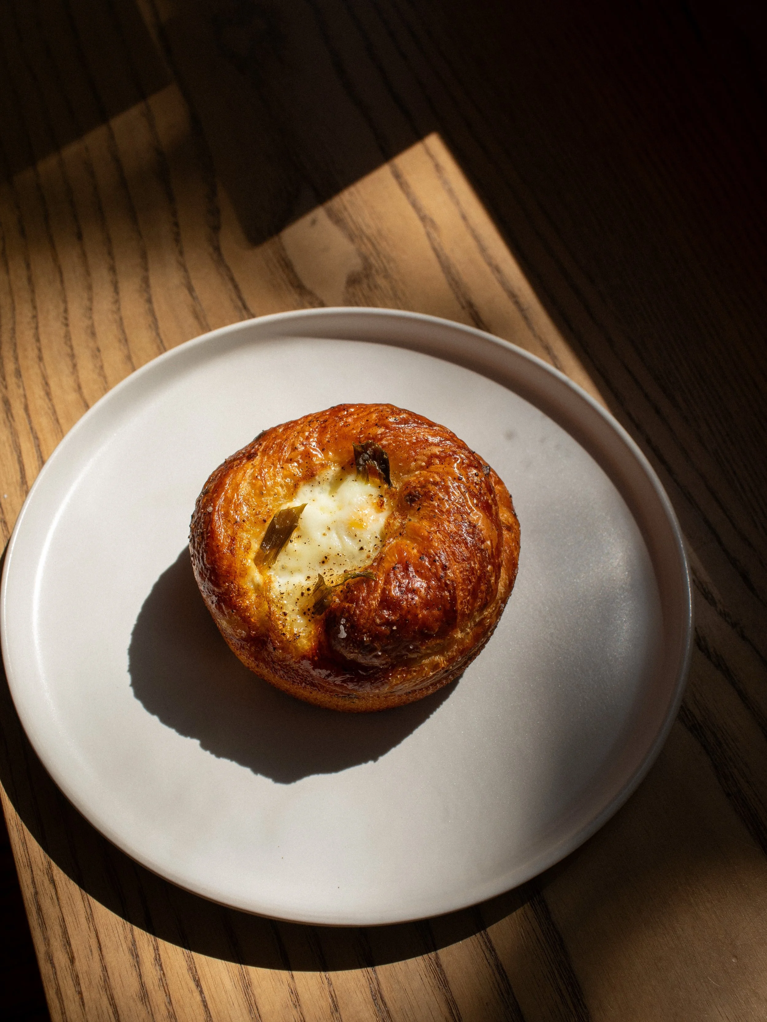 Available at our Western location:

Laminated miso &amp; chive egg bun.