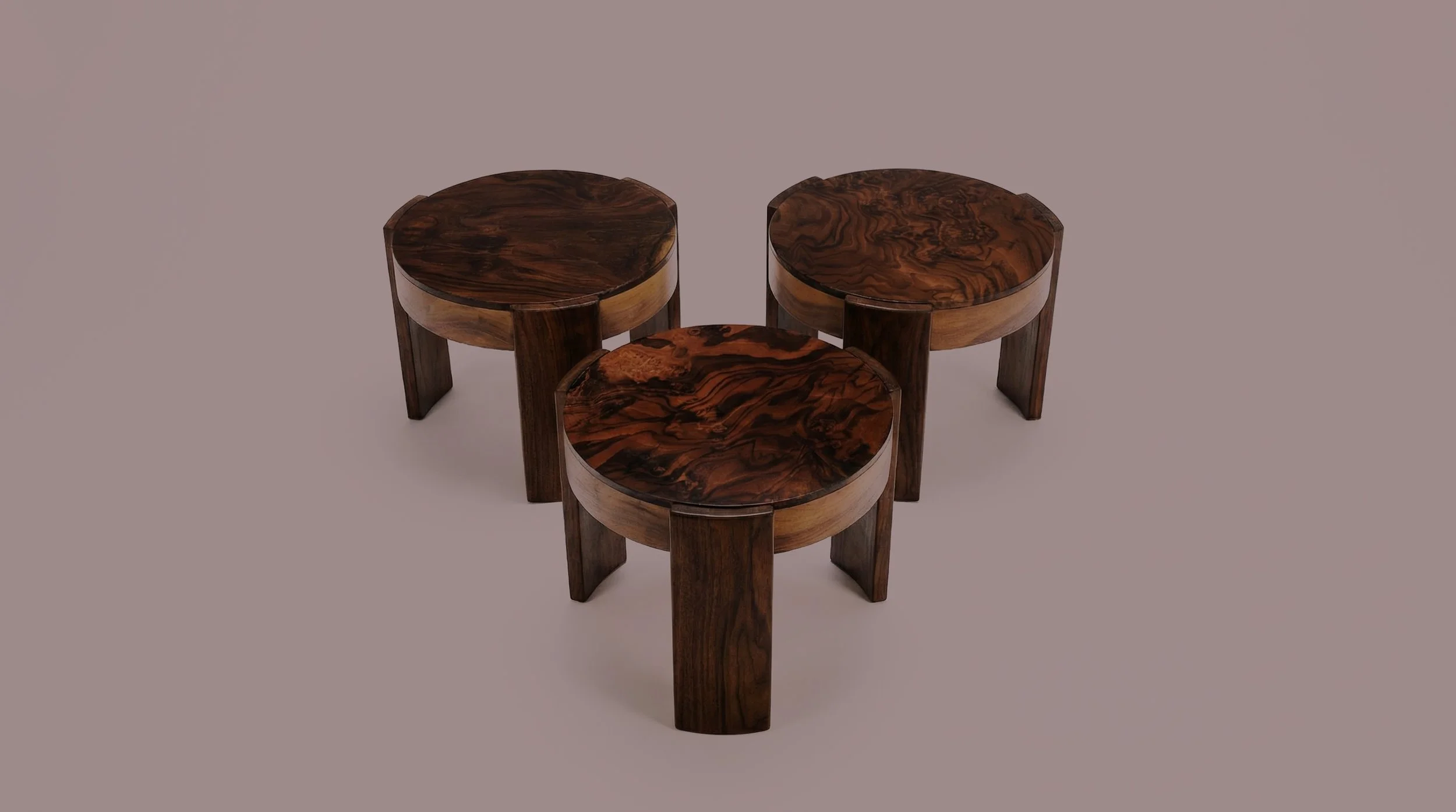 Three round wooden tables with dark, polished surfaces and thick legs, arranged in a triangular formation on a plain, light-colored background.