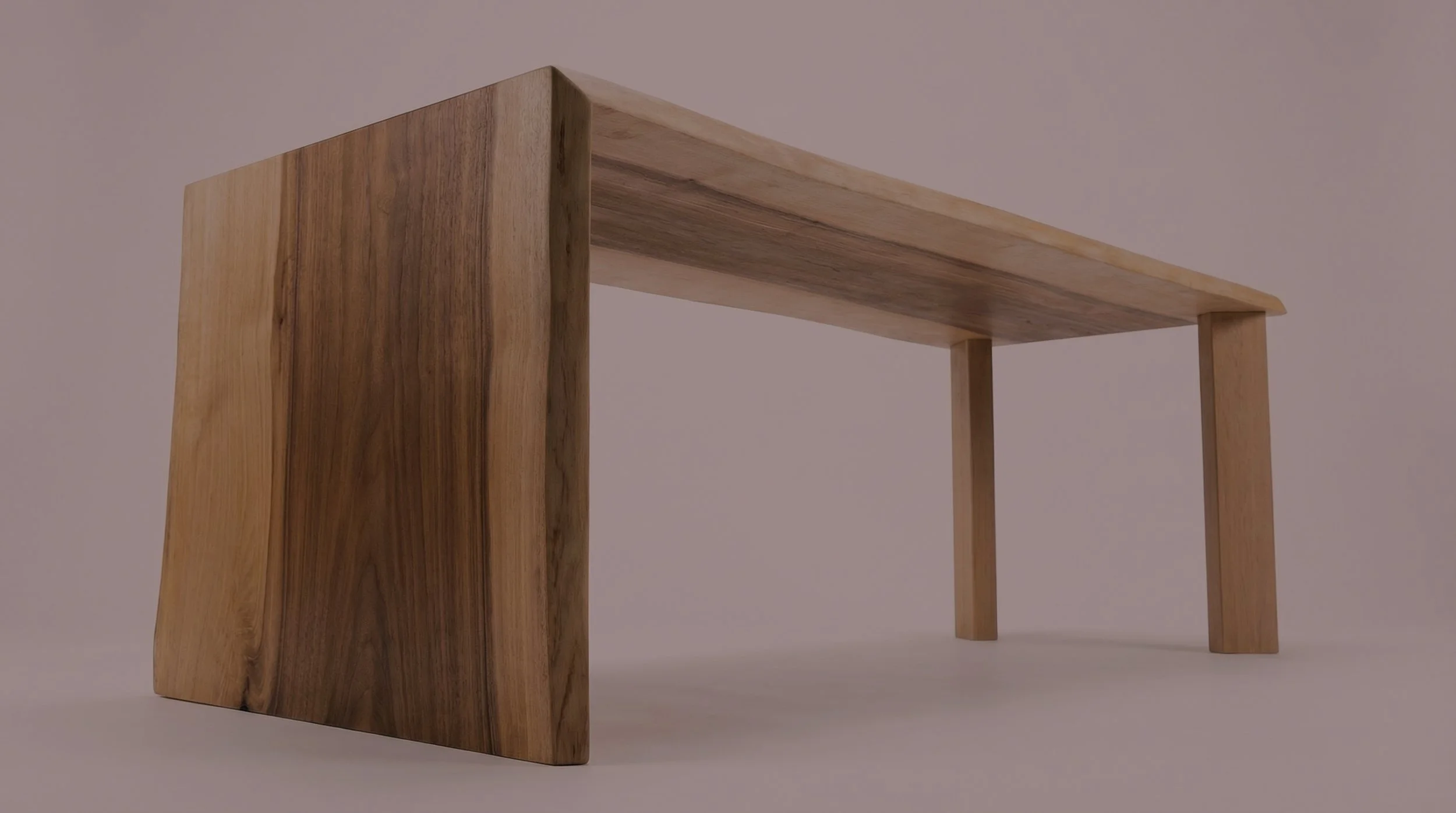 A wooden table with a thick, natural edge tabletop and slender legs, made from wood with visible grain patterns.