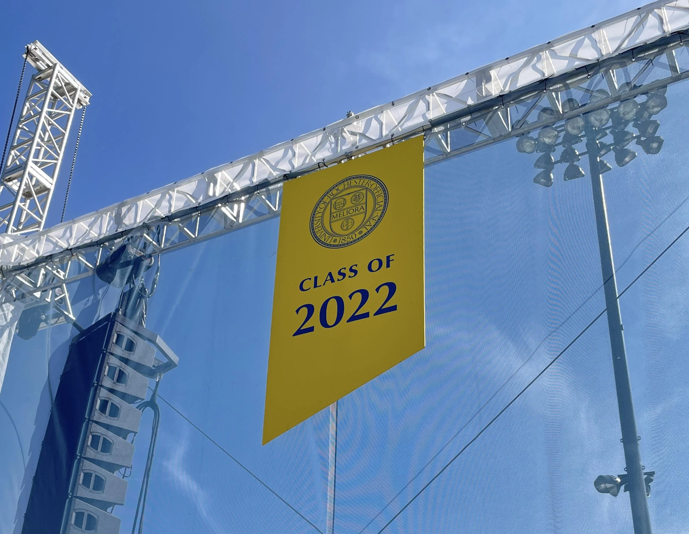 The upward angle evoked the university's motto of "ever better" and became part of the visual language of the event.