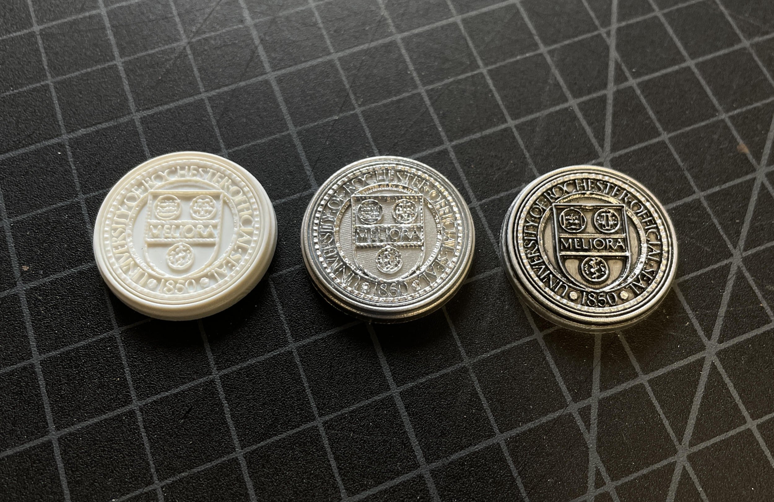 The university seal, 3D printed and then mounted to the top of the steel crosspiece.