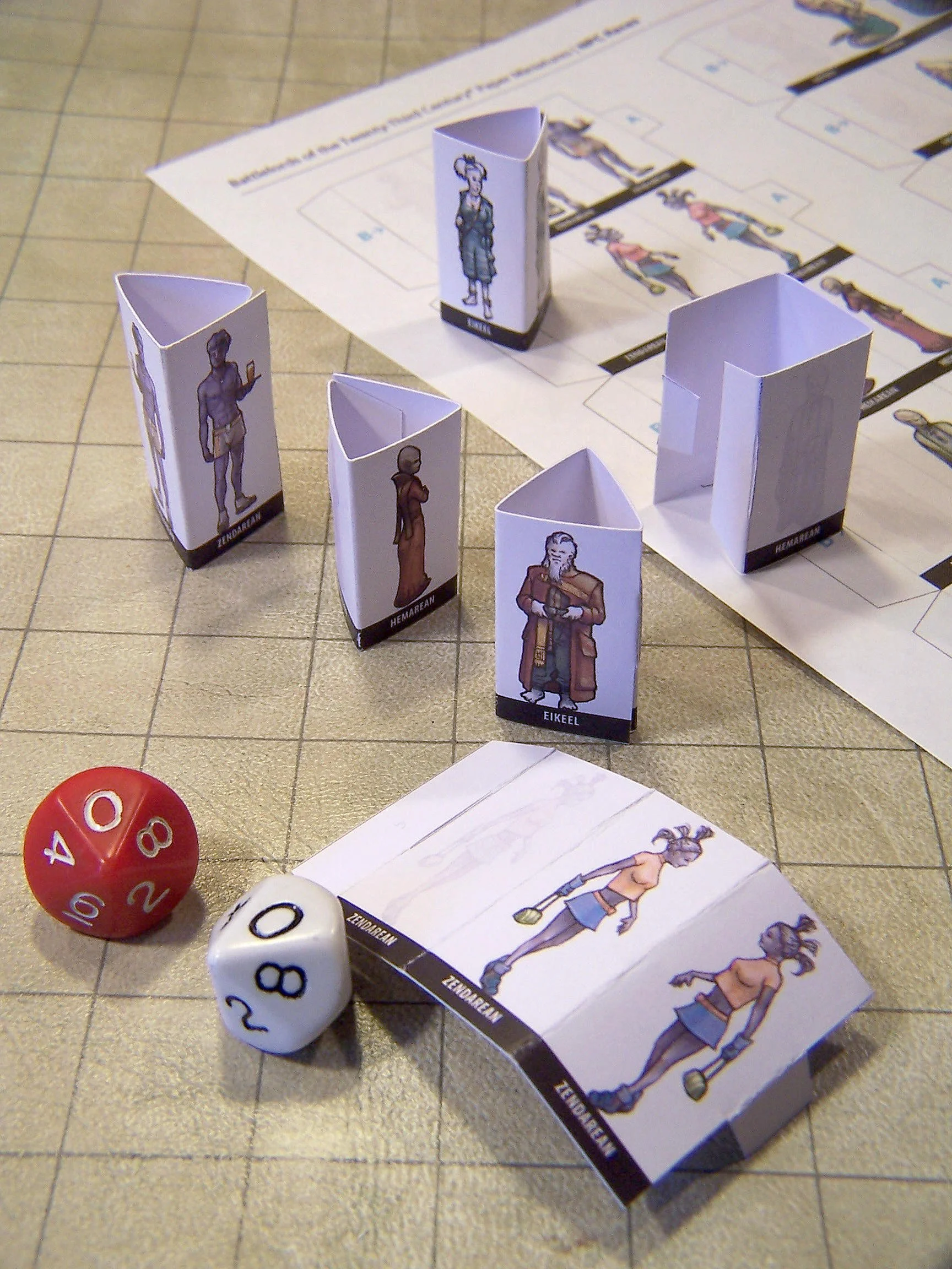 Paper miniatures, designed to be cut out and assembled by the user to represent their specific character species while playing with a tabletop map.