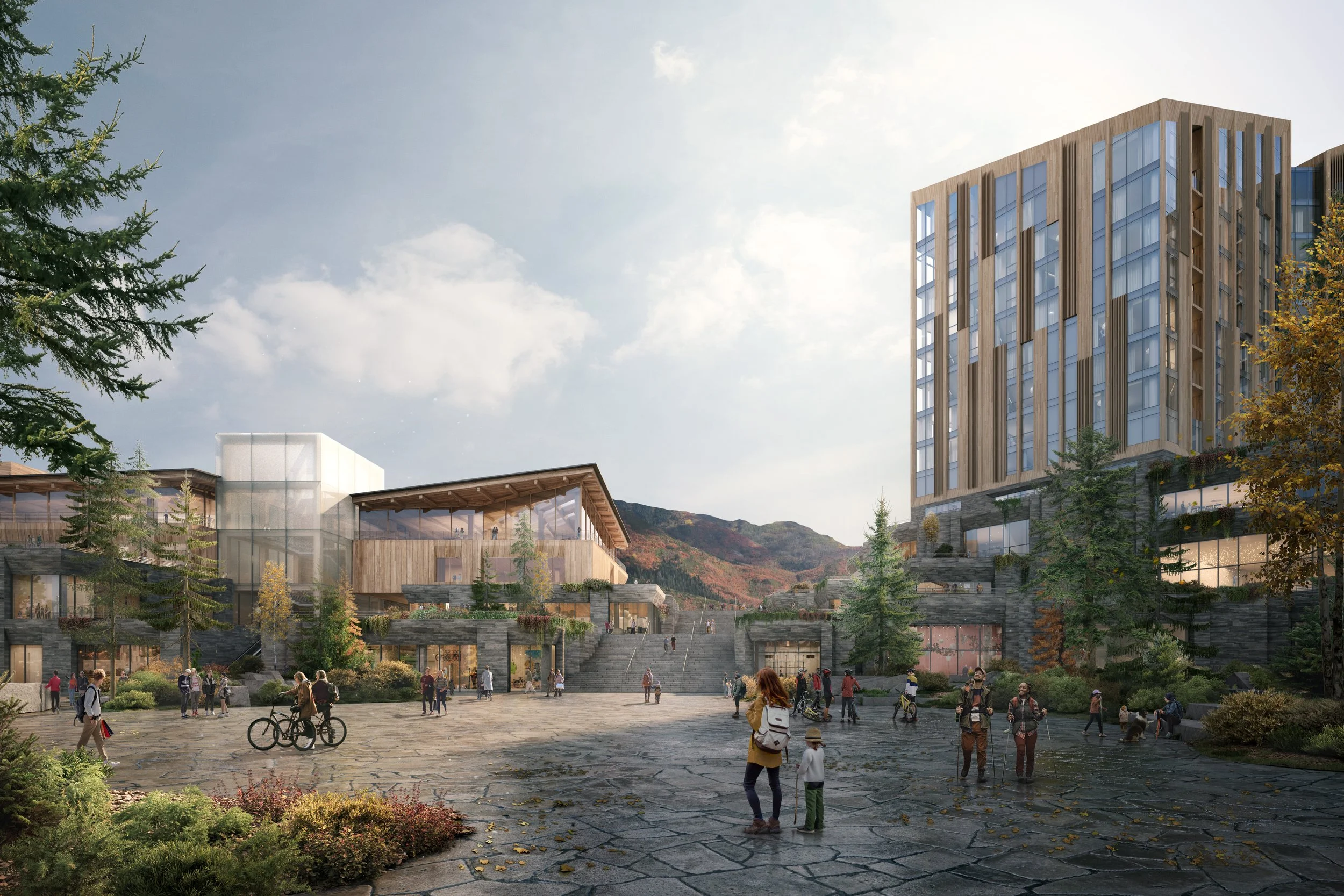 A modern outdoor public space with people walking, biking, and gathering, surrounded by contemporary buildings and trees, with a mountain backdrop and cloudy sky.