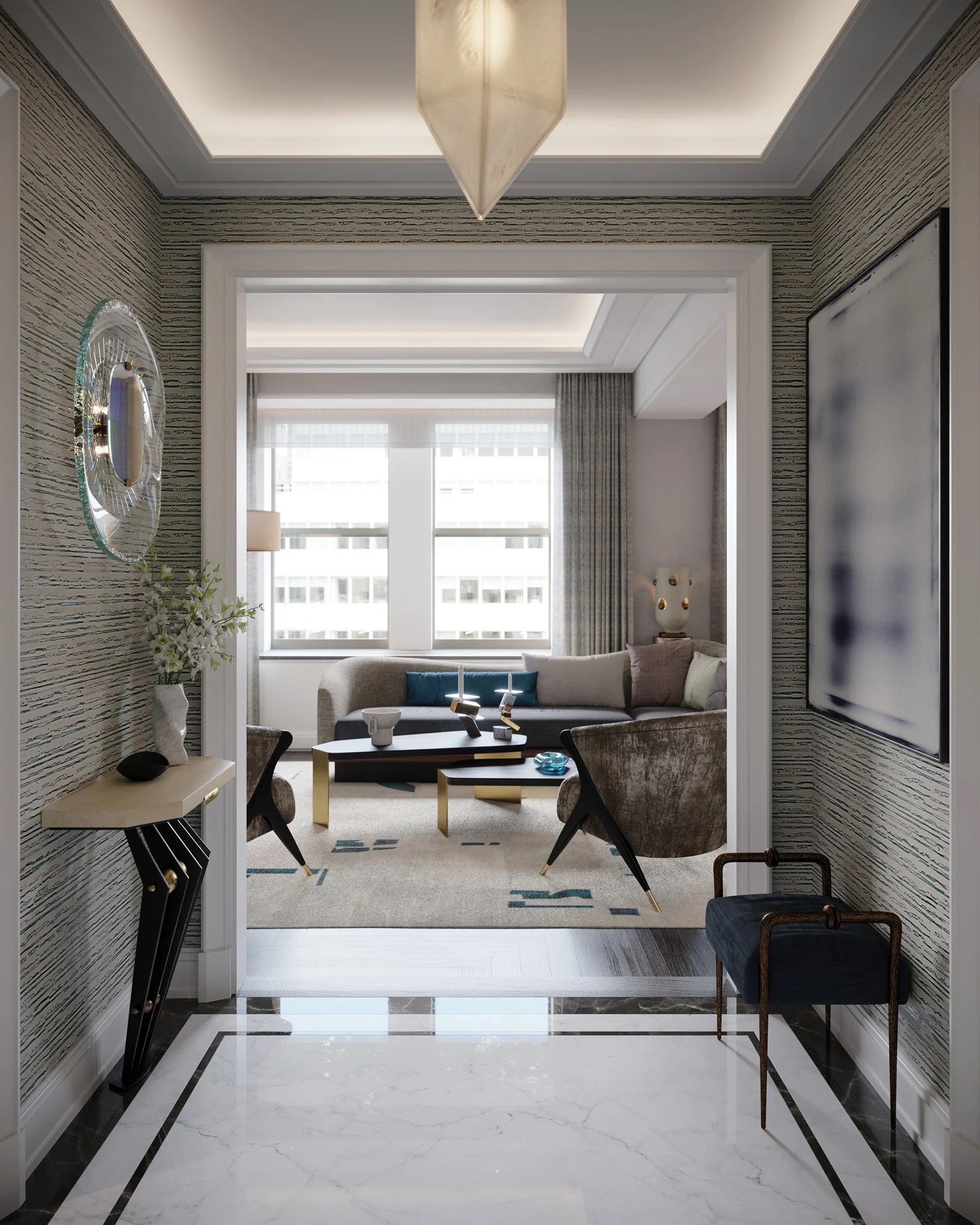 View from an entryway into a living room with large windows, a beige sofa, modern black and gold coffee table, armchairs, and contemporary wall decor