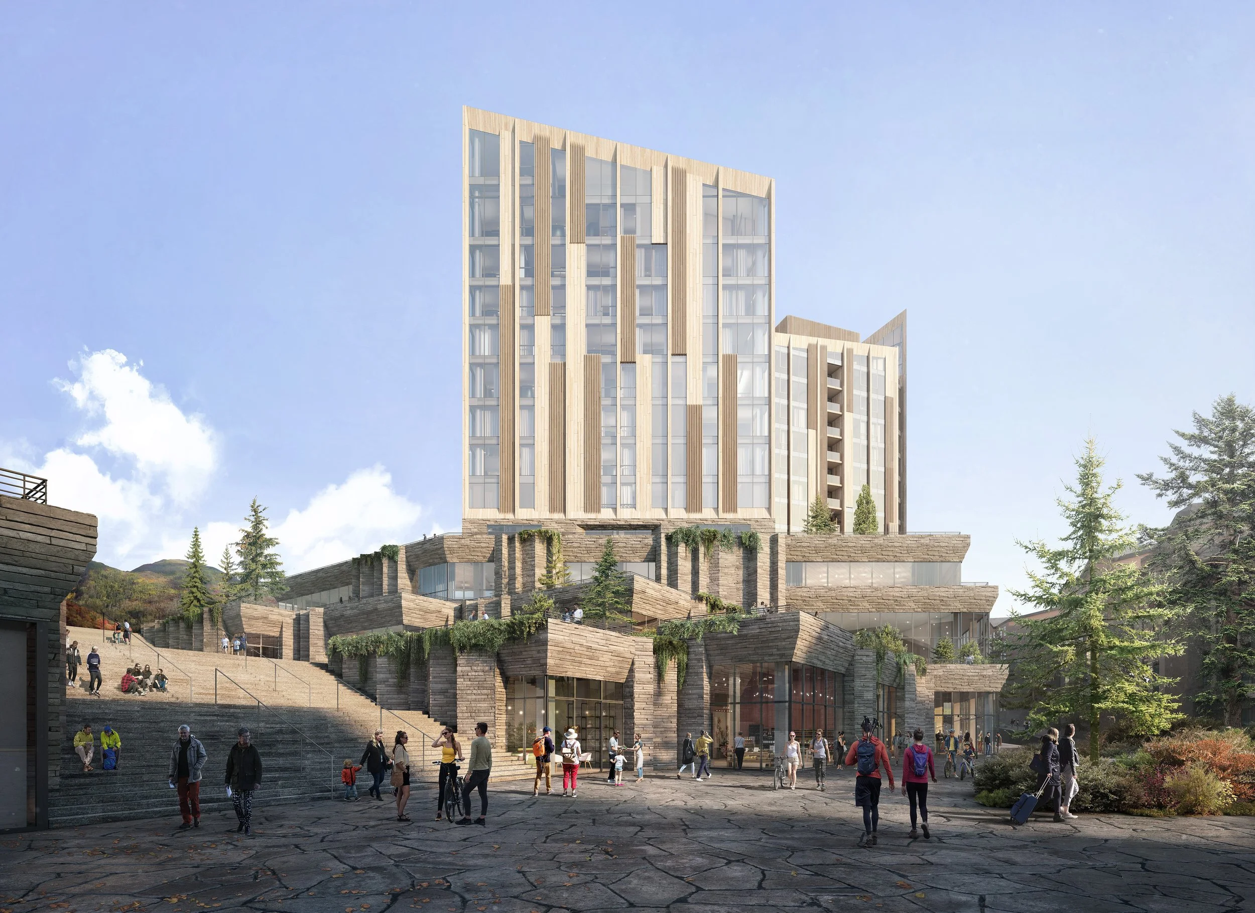 A modern multi-story building with a mixed-use base and a taller structure behind, situated on a landscaped hillside with steps and outdoor seating, surrounded by trees with people walking and gathering in the foreground.