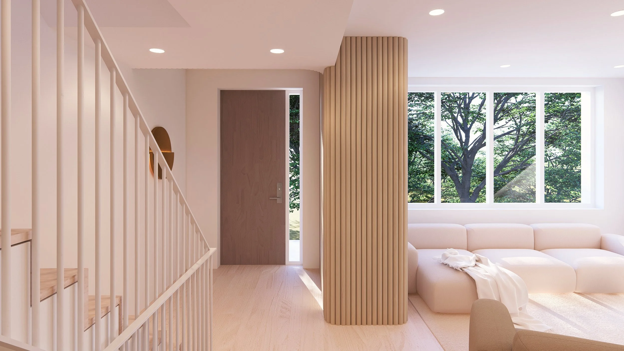 Bright and airy living room with large window overlooking a tree. Features a white sectional sofa, light-colored wooden flooring, and vertical wooden slat room divider.