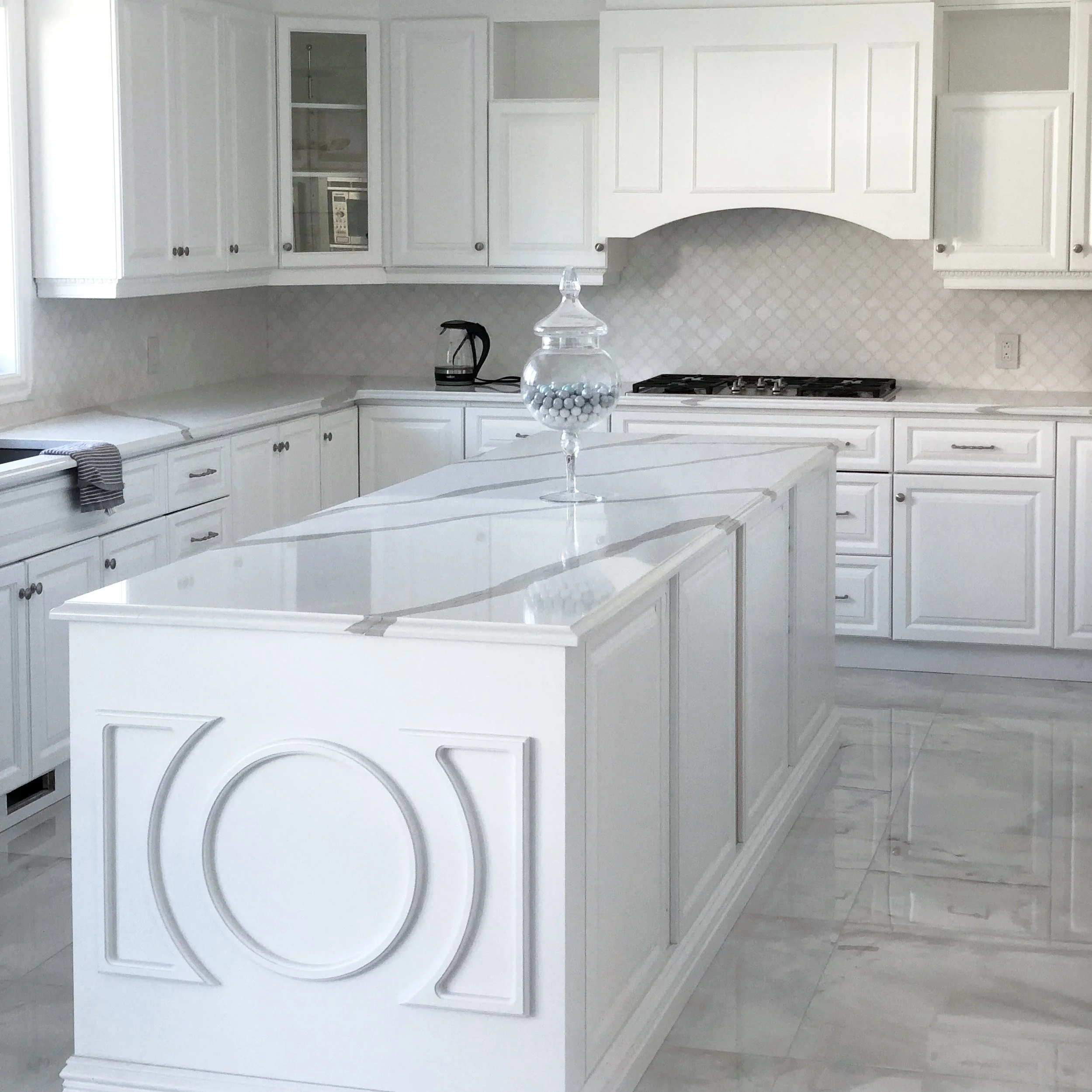 Modern kitchen transformation in Ile des Sœurs, Greater Montreal Area, delivering a balance of aesthetics and everyday usability