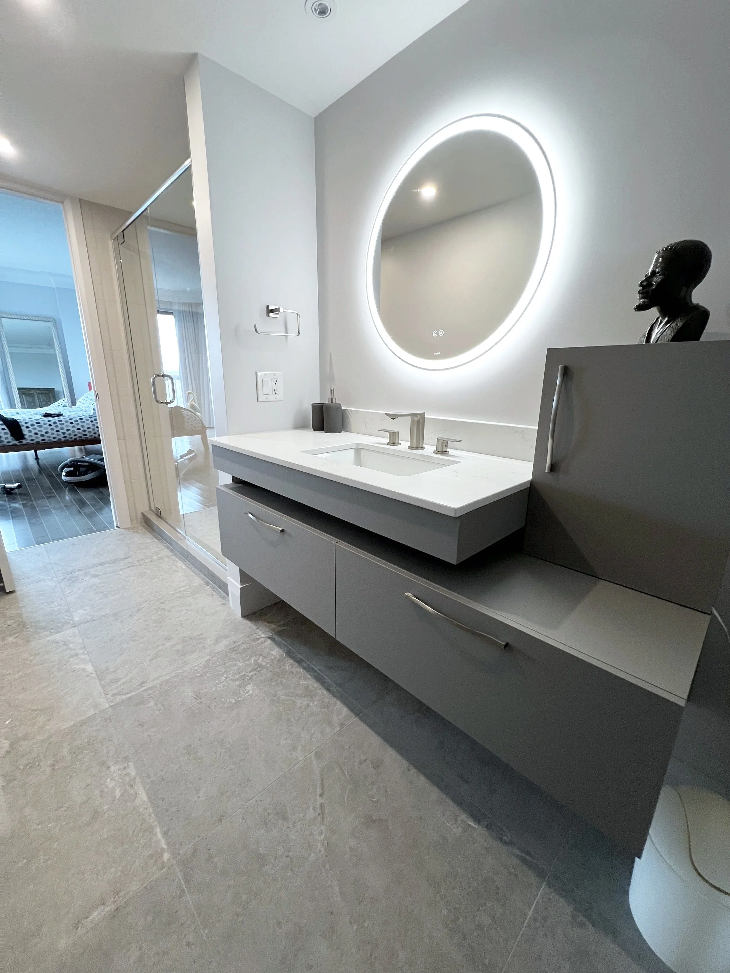 Modern bathroom transformation in a Laval condo, Greater Montreal Area, with upgraded plumbing, lighting, and contemporary design elements
