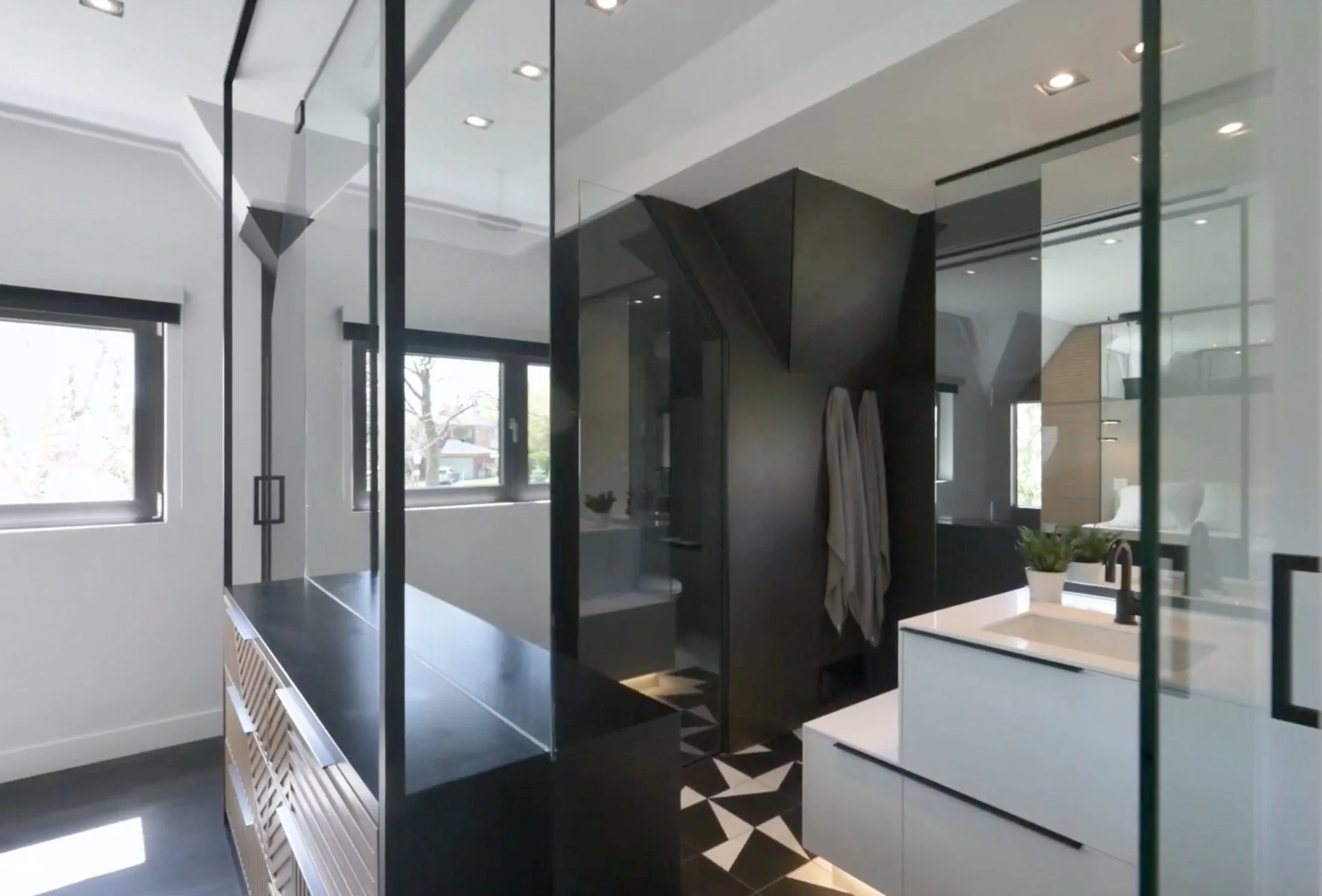 High-end bathroom renovation in Town of Mont-Royal, Greater Montreal Area, featuring custom tile work, modern fixtures, and a clean, architectural layout