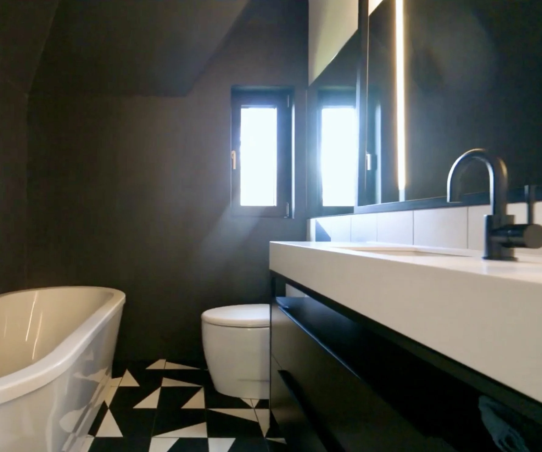 Upscale bathroom renovation in Town of Mont-Royal, Greater Montreal Area, featuring custom tile work, modern fixtures, and a clean, architectural layout