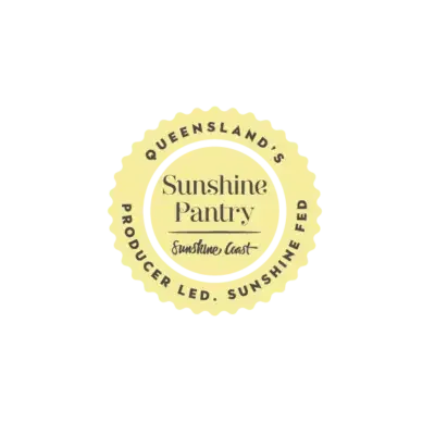Sunshine Pantry logo with a yellow scalloped edge circle, featuring the text 'Queensland, Sunshine Coast' and 'Producer led. Sunshine Fed' around the edges, and 'Sunshine Pantry' with a small sun graphic in the center.