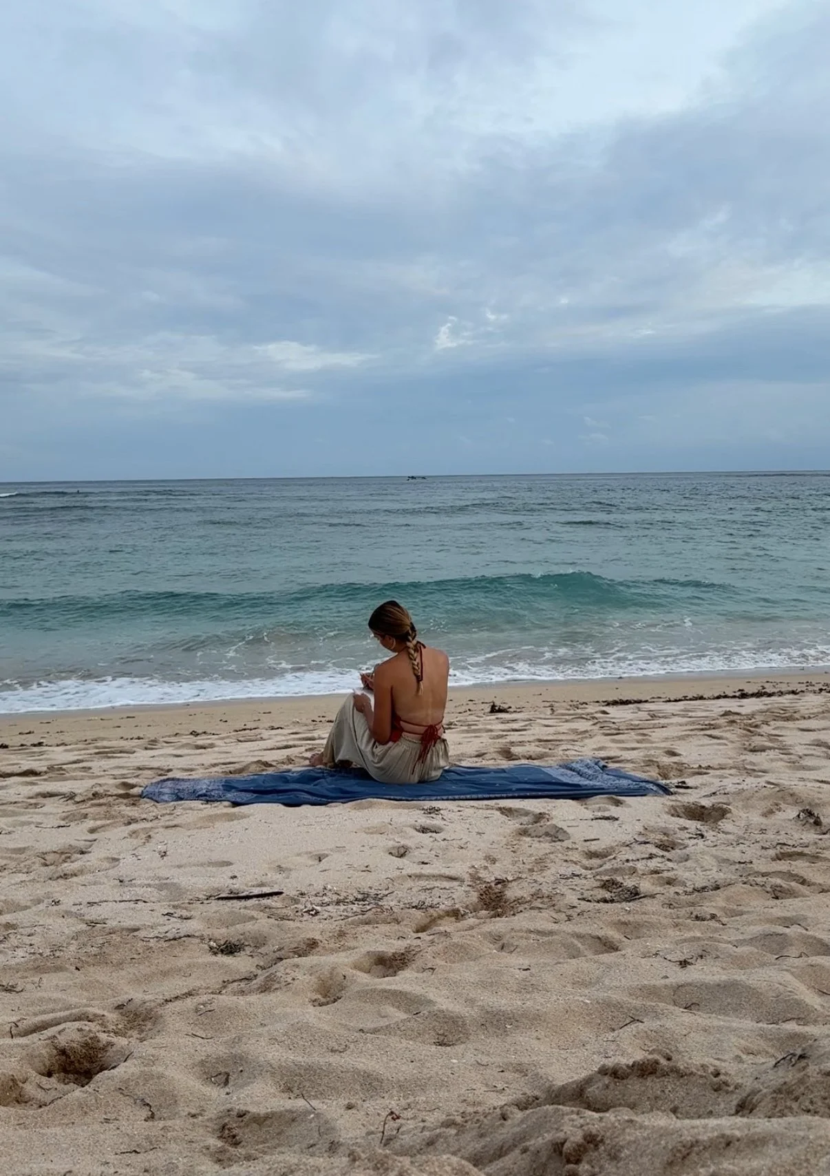 girl on solo date journaling about love