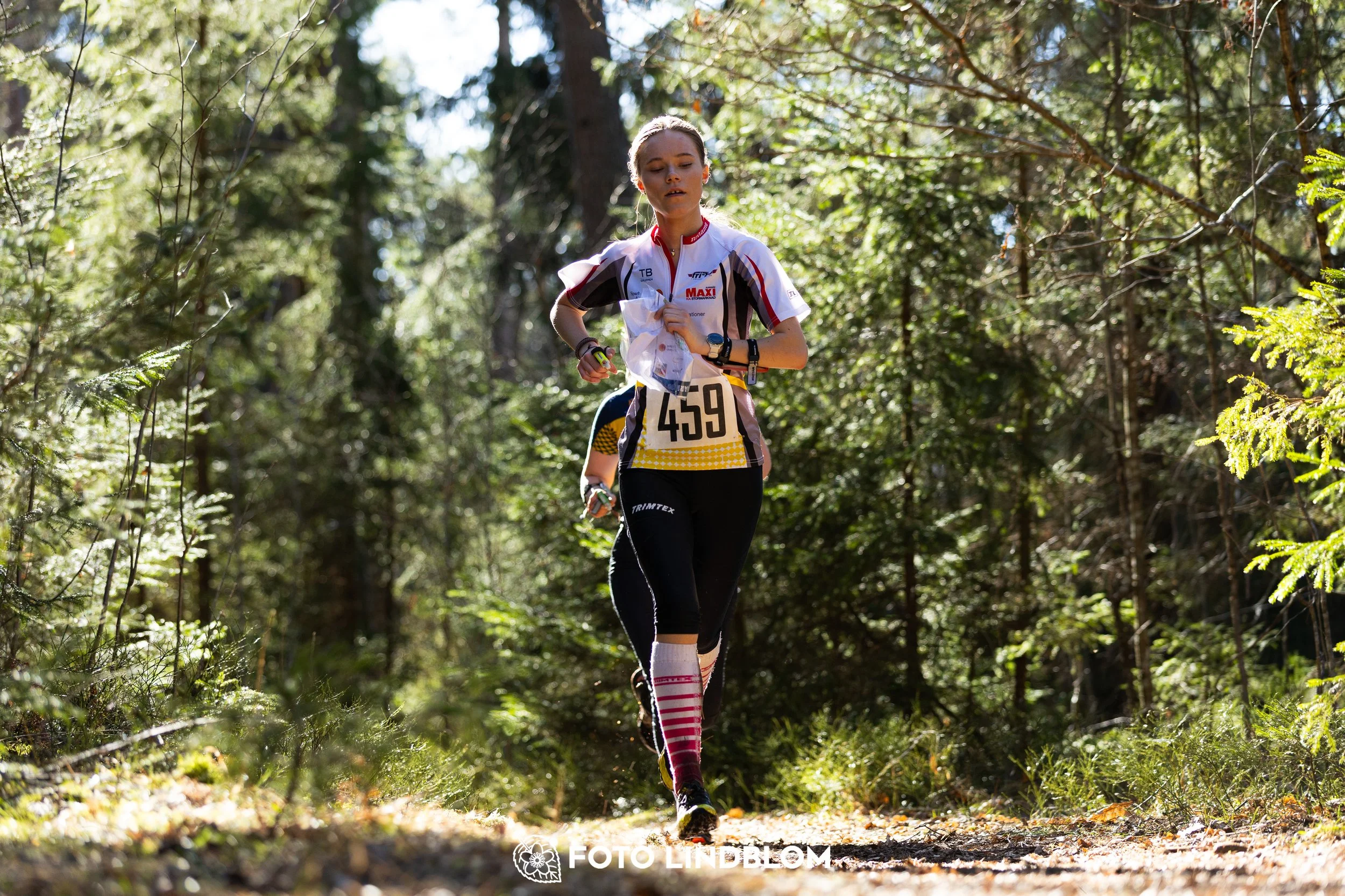 A forest-stage photo from the 2026 Nyköpingsorienteringen orienteering event, taken by Foto Lindblom.