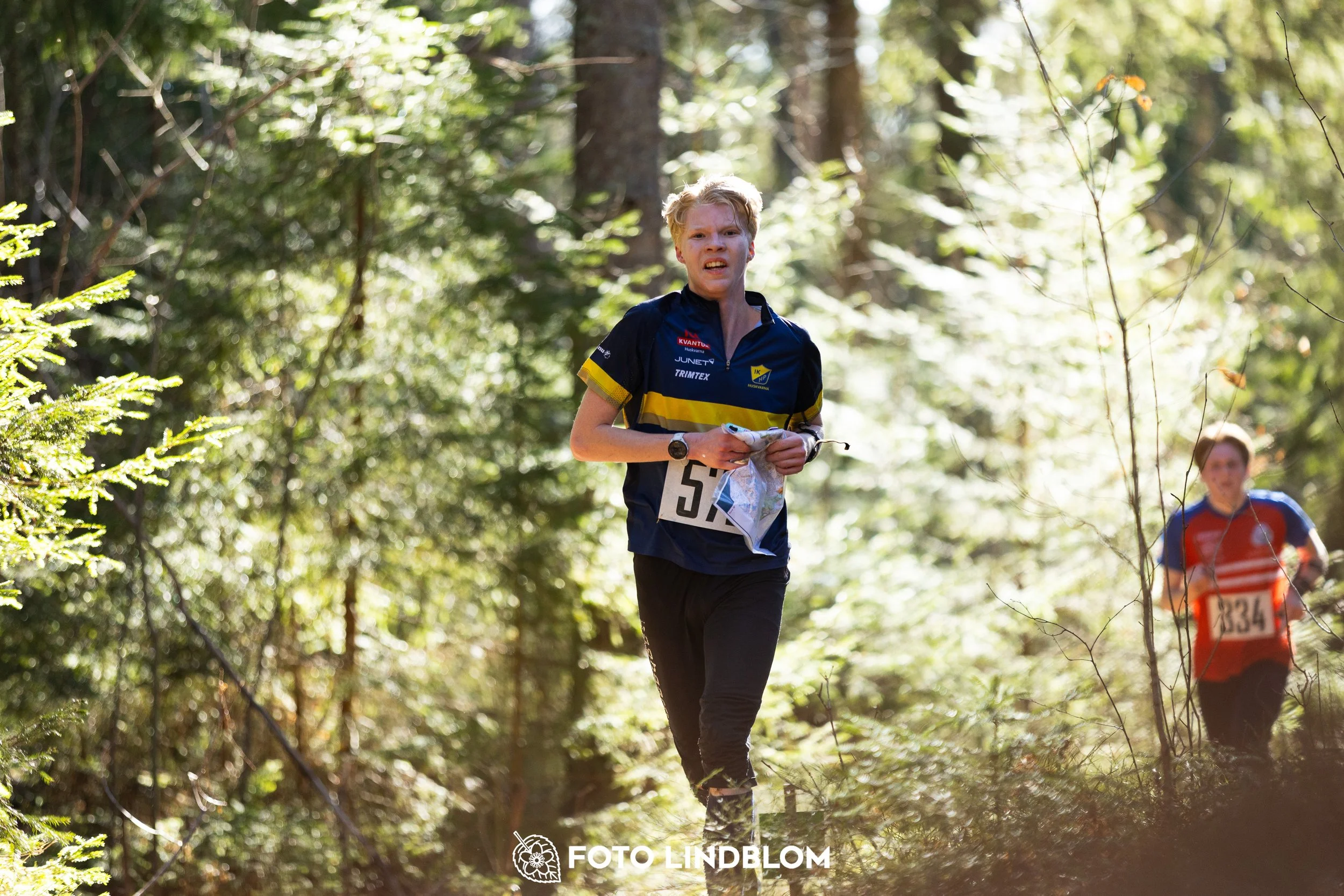 A forest-stage photo from the 2026 Nyköpingsorienteringen orienteering event, taken by Foto Lindblom.