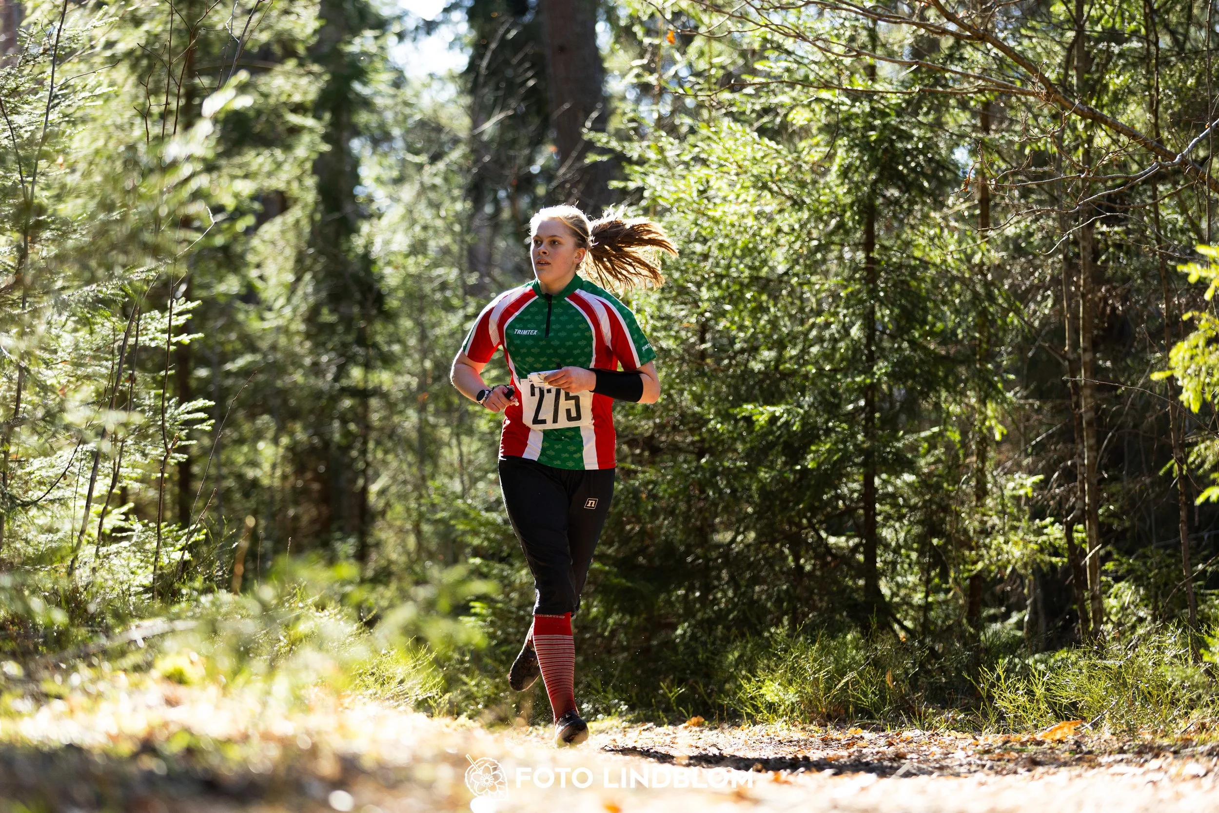 A forest-stage photo from the 2026 Nyköpingsorienteringen orienteering event, taken by Foto Lindblom.