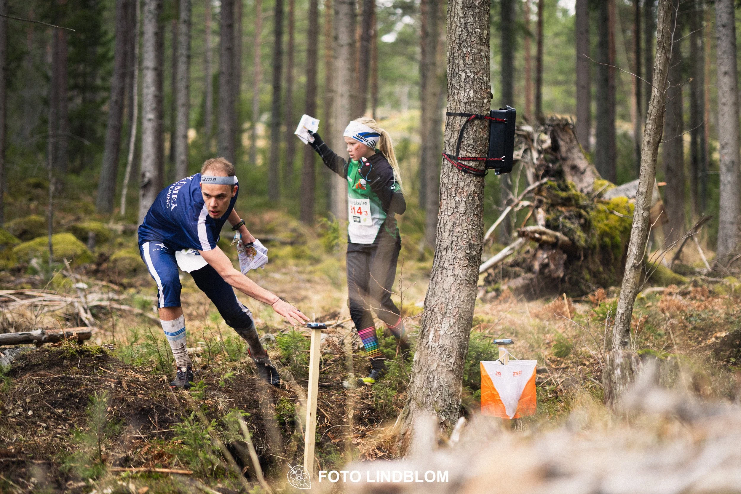 A photo from a relay orienteering competition in Kolmården during the 2026 Stafettligan season, captured by Foto Lindblom.