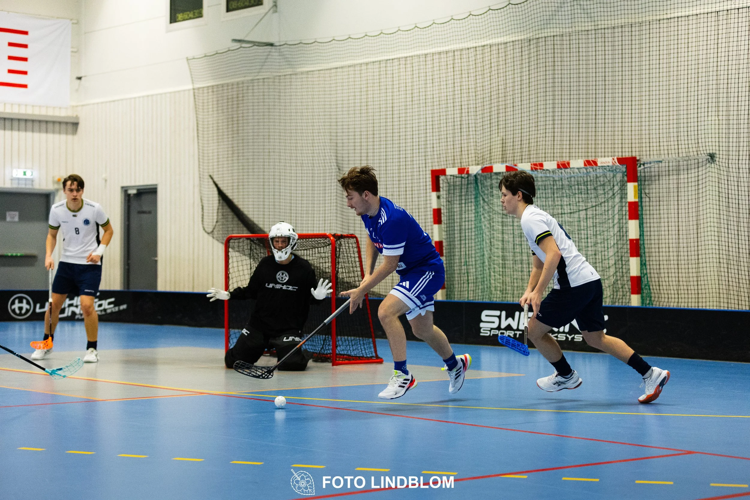 Images of people playing floorball wearing Värmdö IF and FBC Sollentuna team gear. 