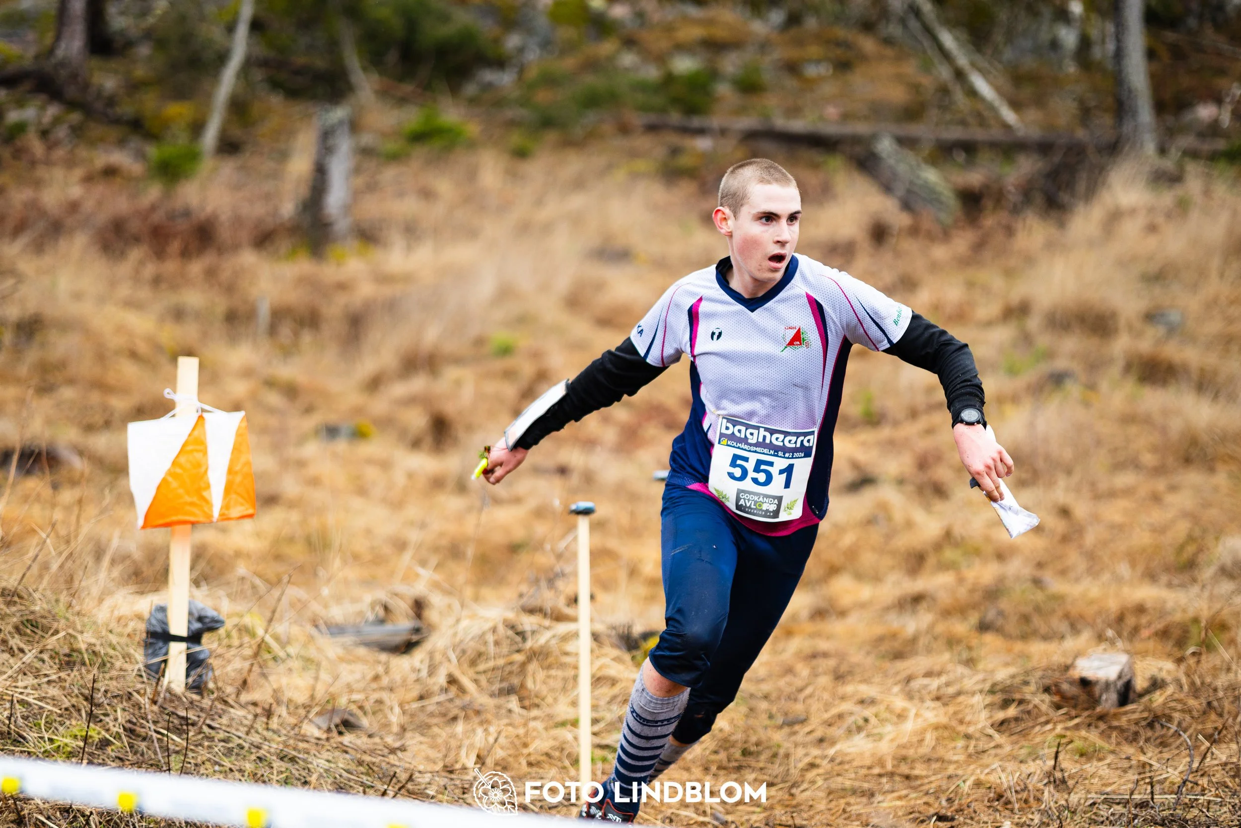 A photo from a Swedish orienteering league race in Kolmården during spring 2026, captured by Foto Lindblom.