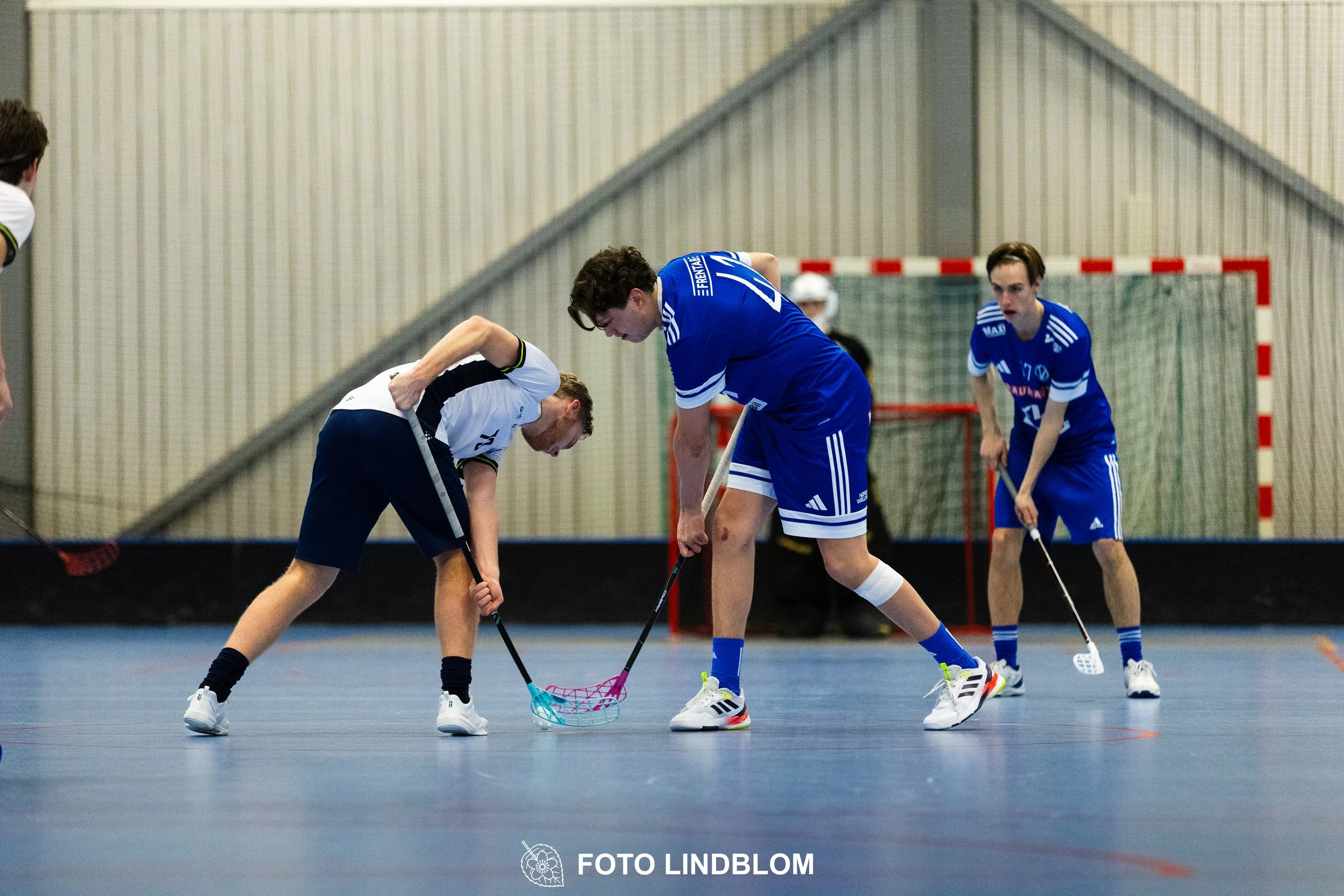 Images of people playing floorball wearing Värmdö IF and FBC Sollentuna team gear. 
