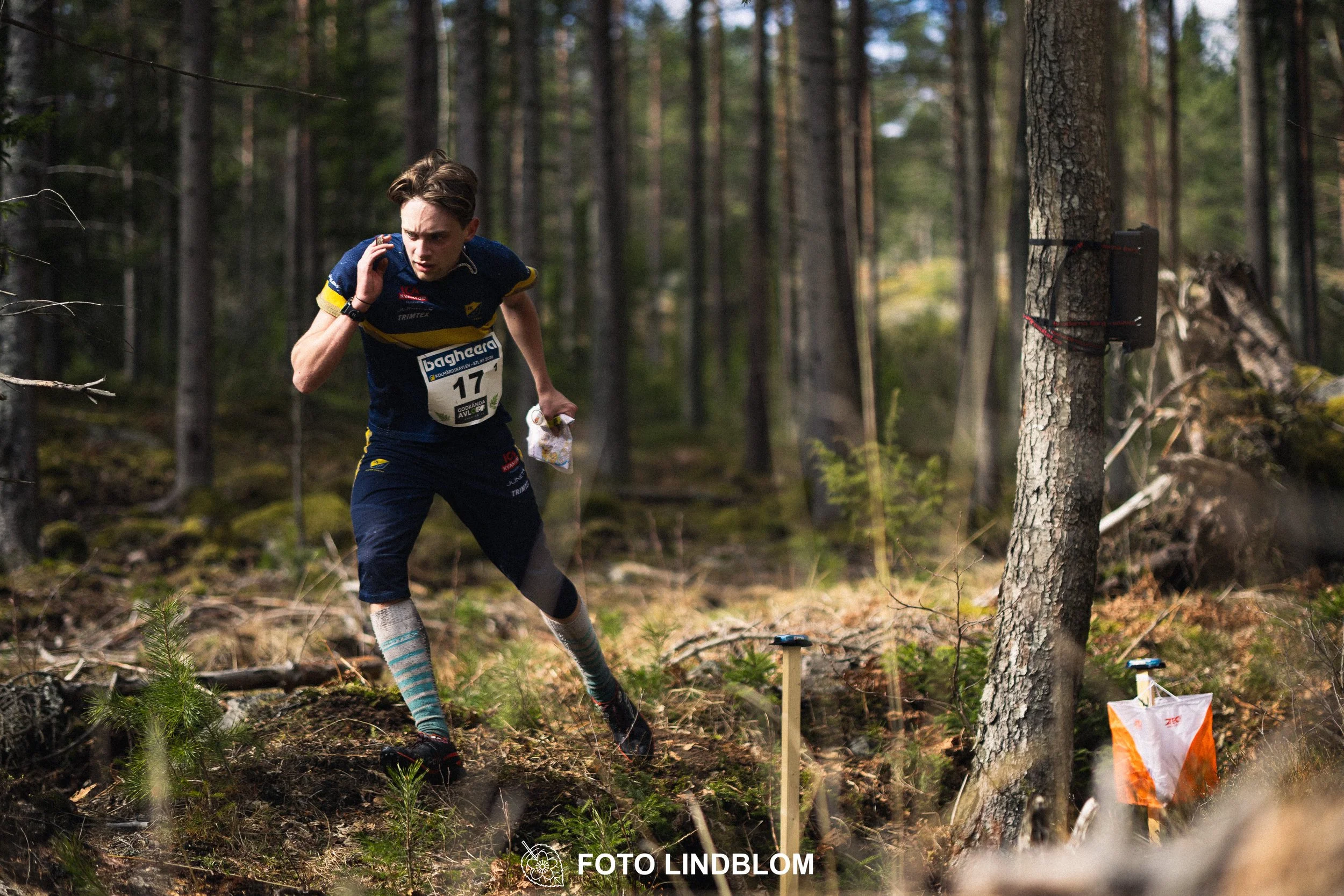A photo from a relay orienteering competition in Kolmården during the 2026 Stafettligan season, captured by Foto Lindblom.