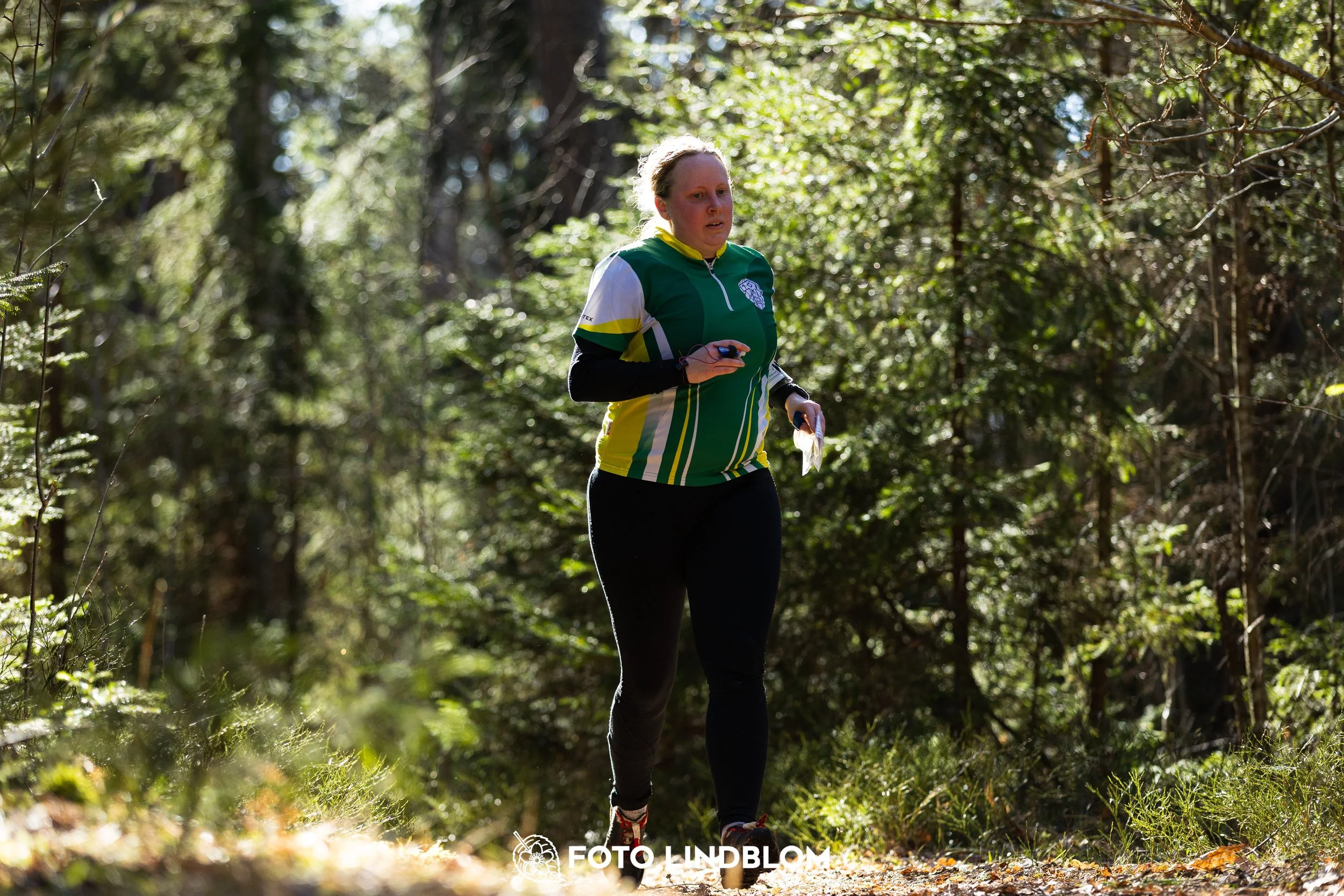 A forest-stage photo from the 2026 Nyköpingsorienteringen orienteering event, taken by Foto Lindblom.