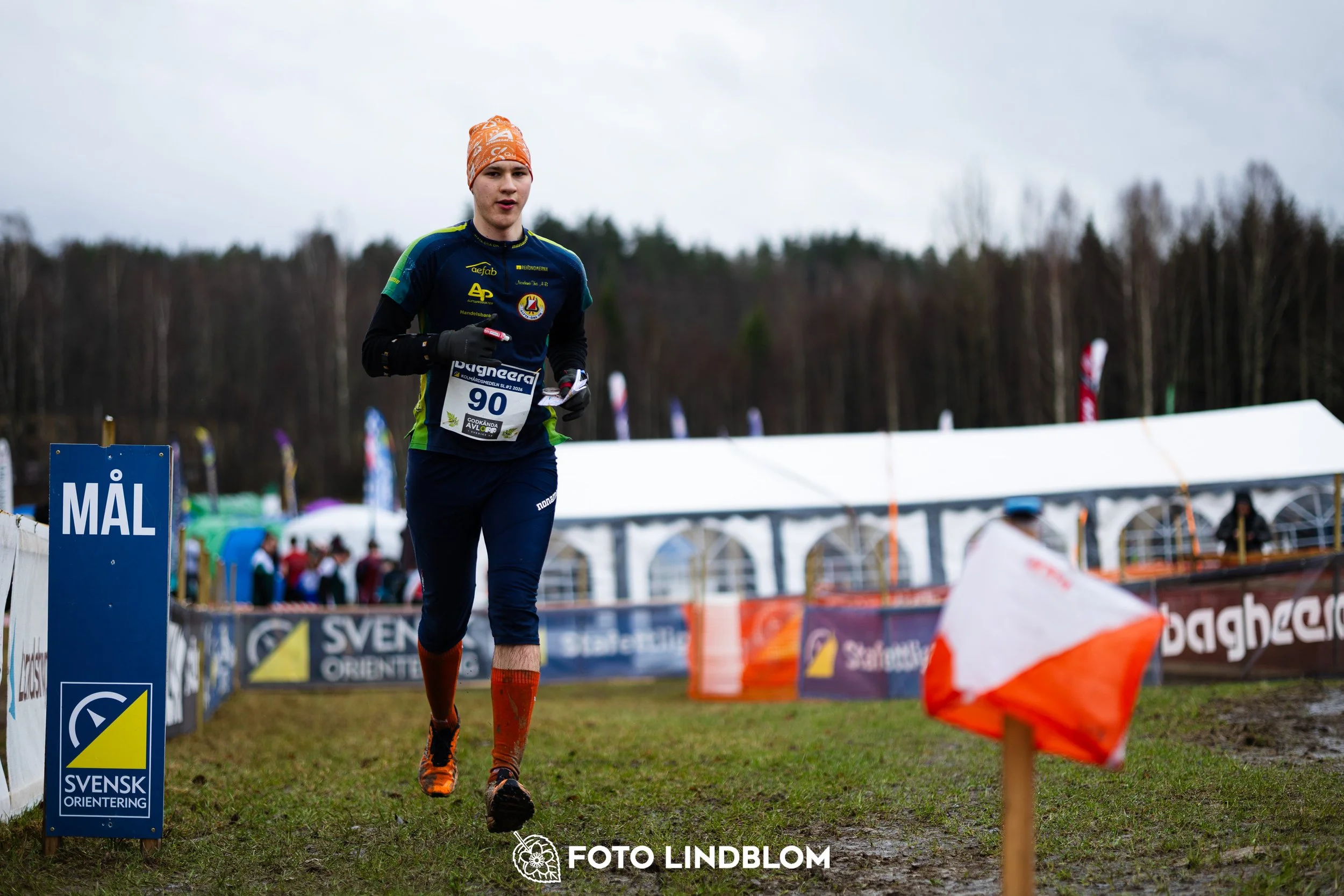 A photo from a Swedish orienteering league race in Kolmården during spring 2026, captured by Foto Lindblom.