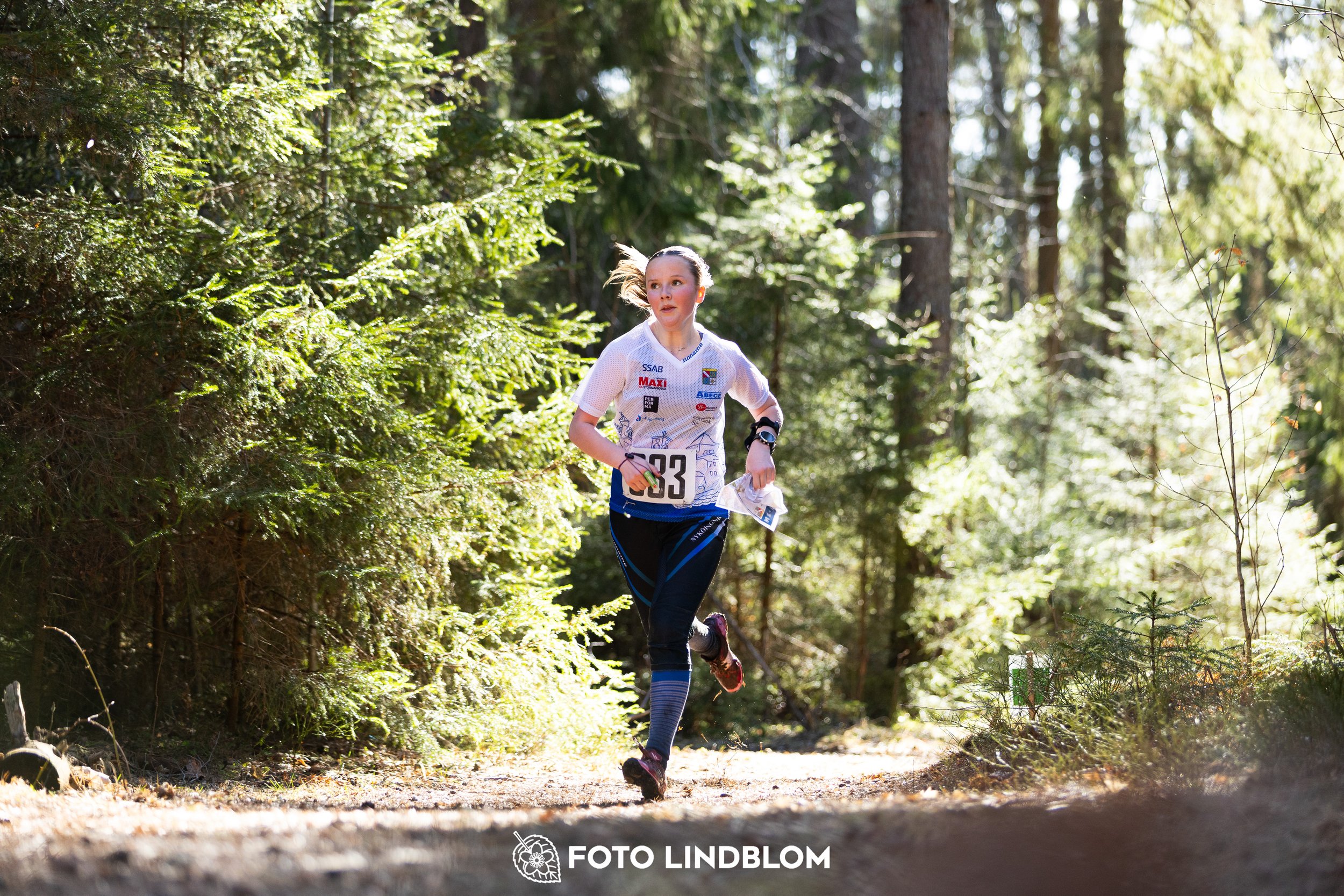 A forest-stage photo from the 2026 Nyköpingsorienteringen orienteering event, taken by Foto Lindblom.