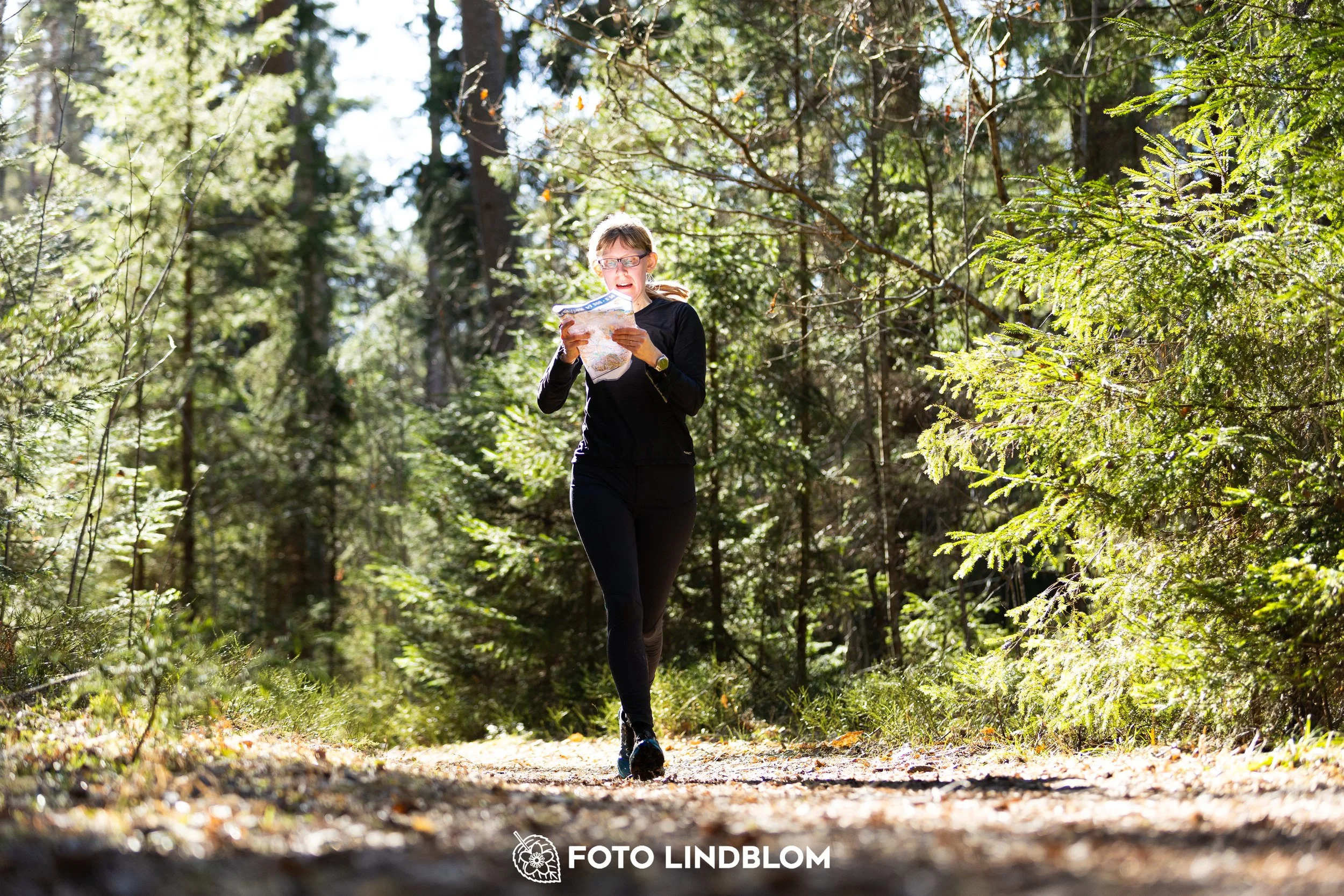 A forest-stage photo from the 2026 Nyköpingsorienteringen orienteering event, taken by Foto Lindblom.