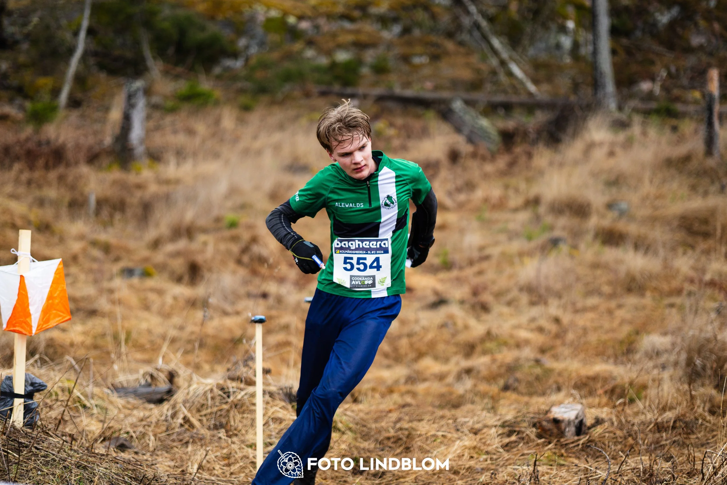 A photo from a Swedish orienteering league race in Kolmården during spring 2026, captured by Foto Lindblom.