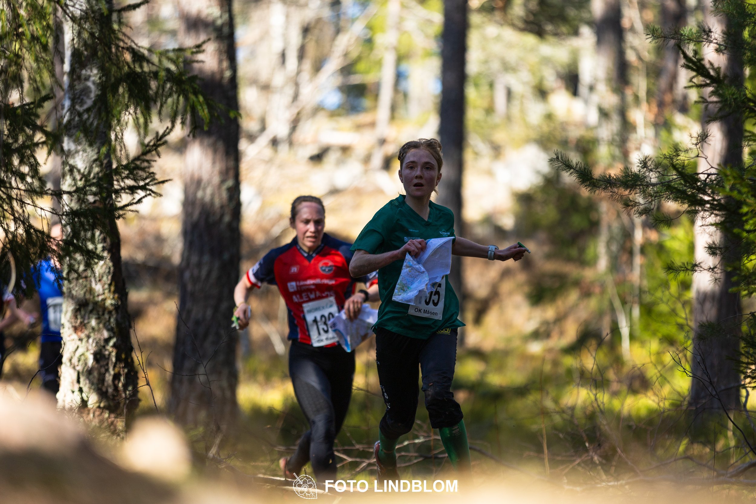 Forest relay orienteering at Måsenstafetten 2026, with teams competing in an endurance event, showing Tuva Östangård, documented by Foto Lindblom.