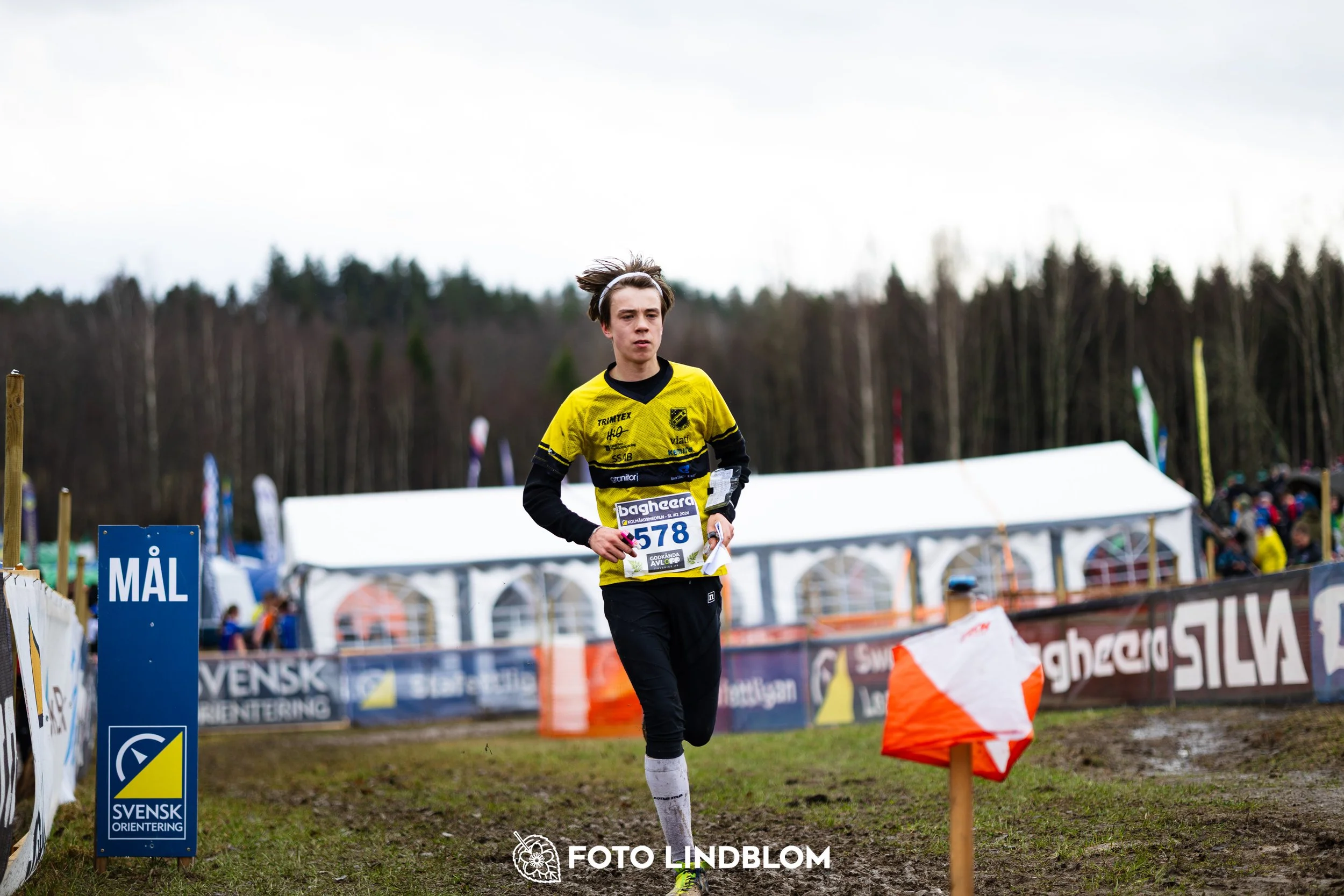 A photo from a forest orienteering competition in Kolmården as part of the Swedish League 2026 season, captured by Foto Lindblom.