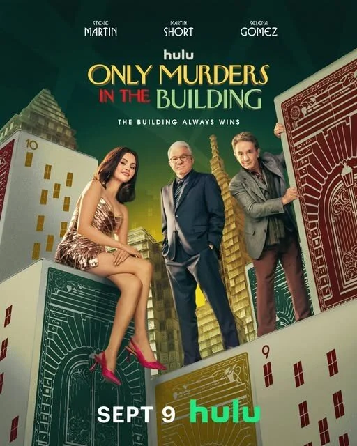 Promotional poster for the TV series "Only Murders in the Building" featuring three main characters standing in front of large building blocks and oversized playing cards. The title and premiere date "Sept 9" are displayed, along with the Hulu logo.