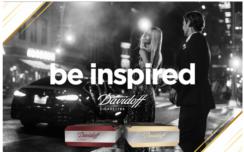 Advertisement featuring a black and white photo of a stylish man and woman in formal attire on a city street at night, with the text 'be inspired' and images of Daviroff cigarette packs.