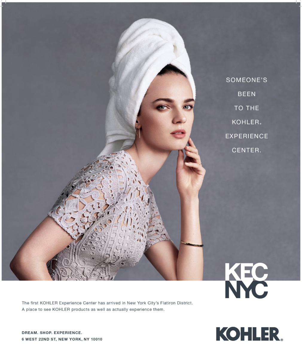 A woman with a towel wrapped around her hair, wearing a lace dress, looking at the camera against a gray background. Text overlays say, "Someone's been to the Kohler Experience Center."