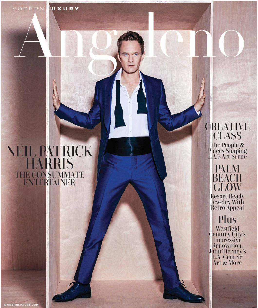 Magazine cover featuring Neil Patrick Harris in a blue suit with black accessories, standing inside a wooden box like structure, with various headlines and articles listed around him.