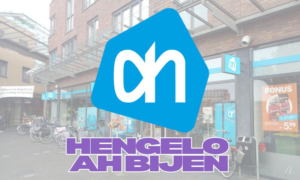 Foto van een supermarkt met fietsen voor de ingang, een grote AH-logo en tekst 'HENGEL O AHBJEN'.