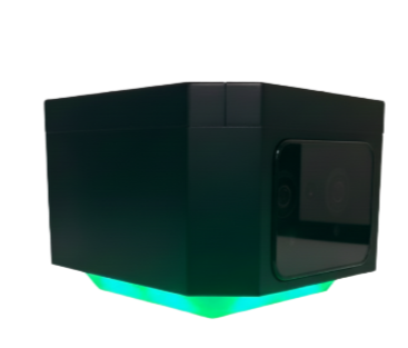 A black rectangular device with a small camera and a display, glowing green light at the bottom.